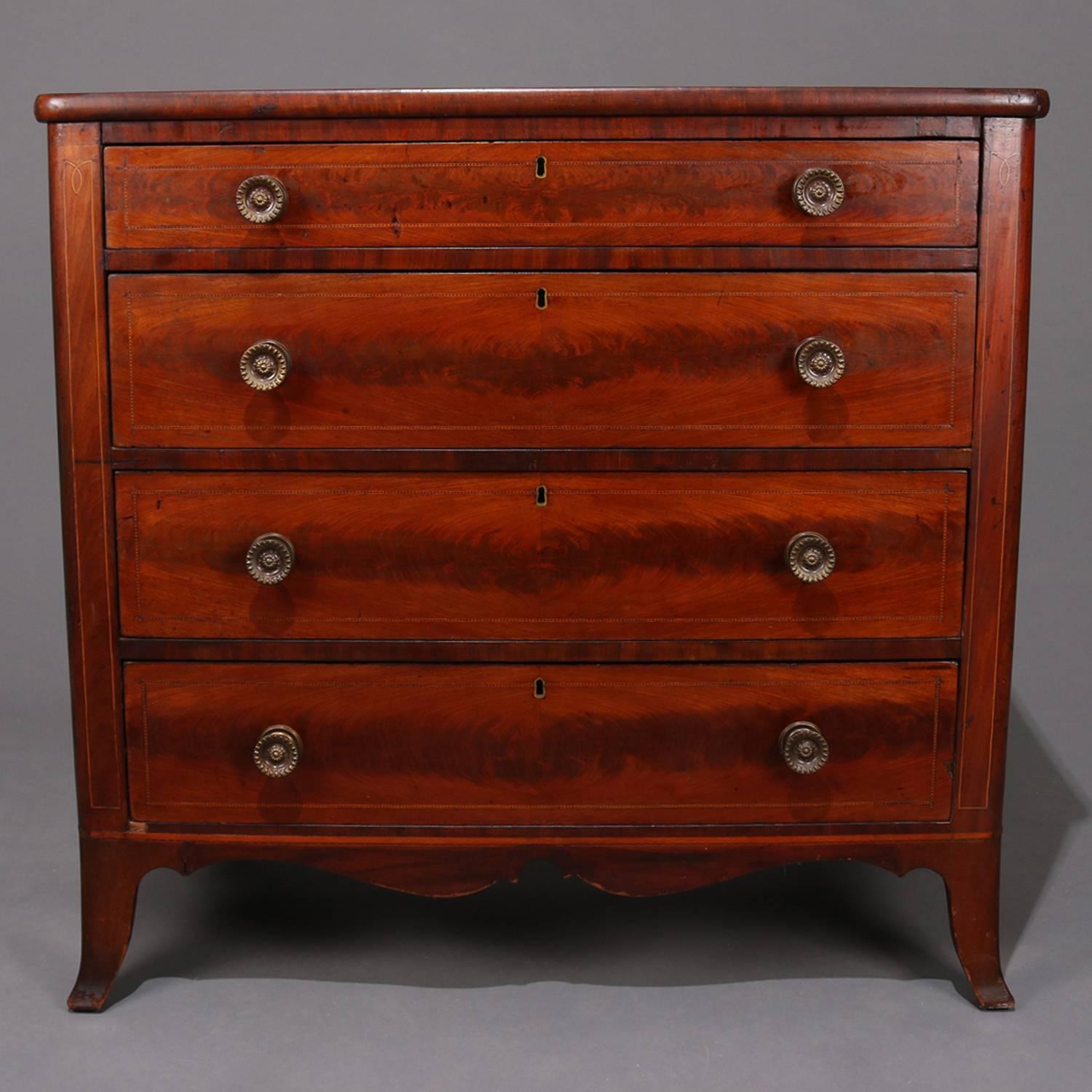 Antique Hepplewhite form flame mahogany chest features four long drawers with bookmatched flame mahogany with ebonized banding, satinwood banded case with scalloped apron and raised on flared and tapered legs, bronze pulls, circa 1820.

Measures: