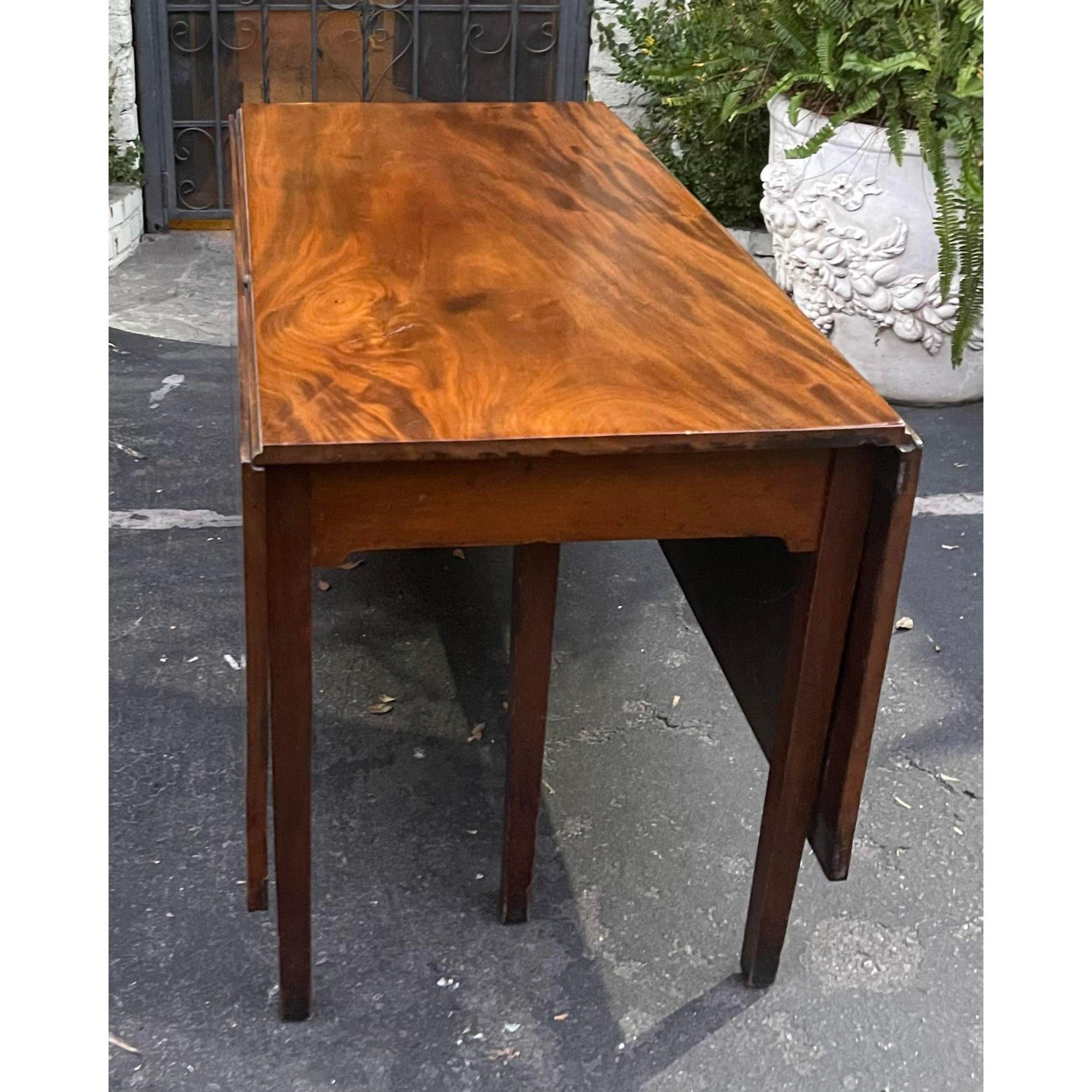 Antique 18th C English Honduran mahogany drop lead dining table.
Opens to 64” long.

Additional information:
Materials: mahogany.
Please note that this item contains materials that are legally subject to a special export process that may extend