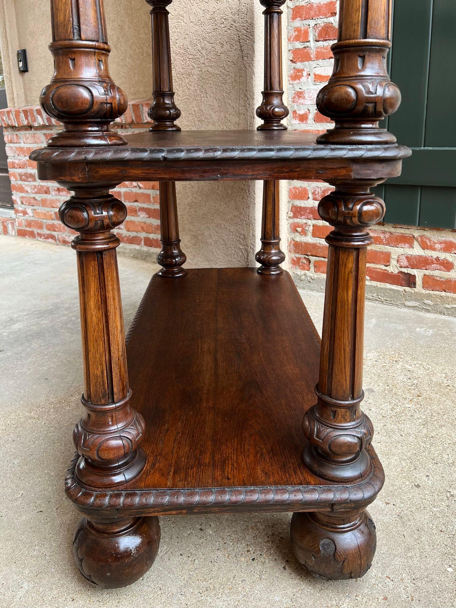 Antique English hotel dumbwaiter server cart sideboard carved oak display shelf.

 Direct from England, a fabulous and quite rare antique hotel server or dumbwaiter. Oversized and quite majestic, almost 4 ft. tall and 4 ft. length, the server has