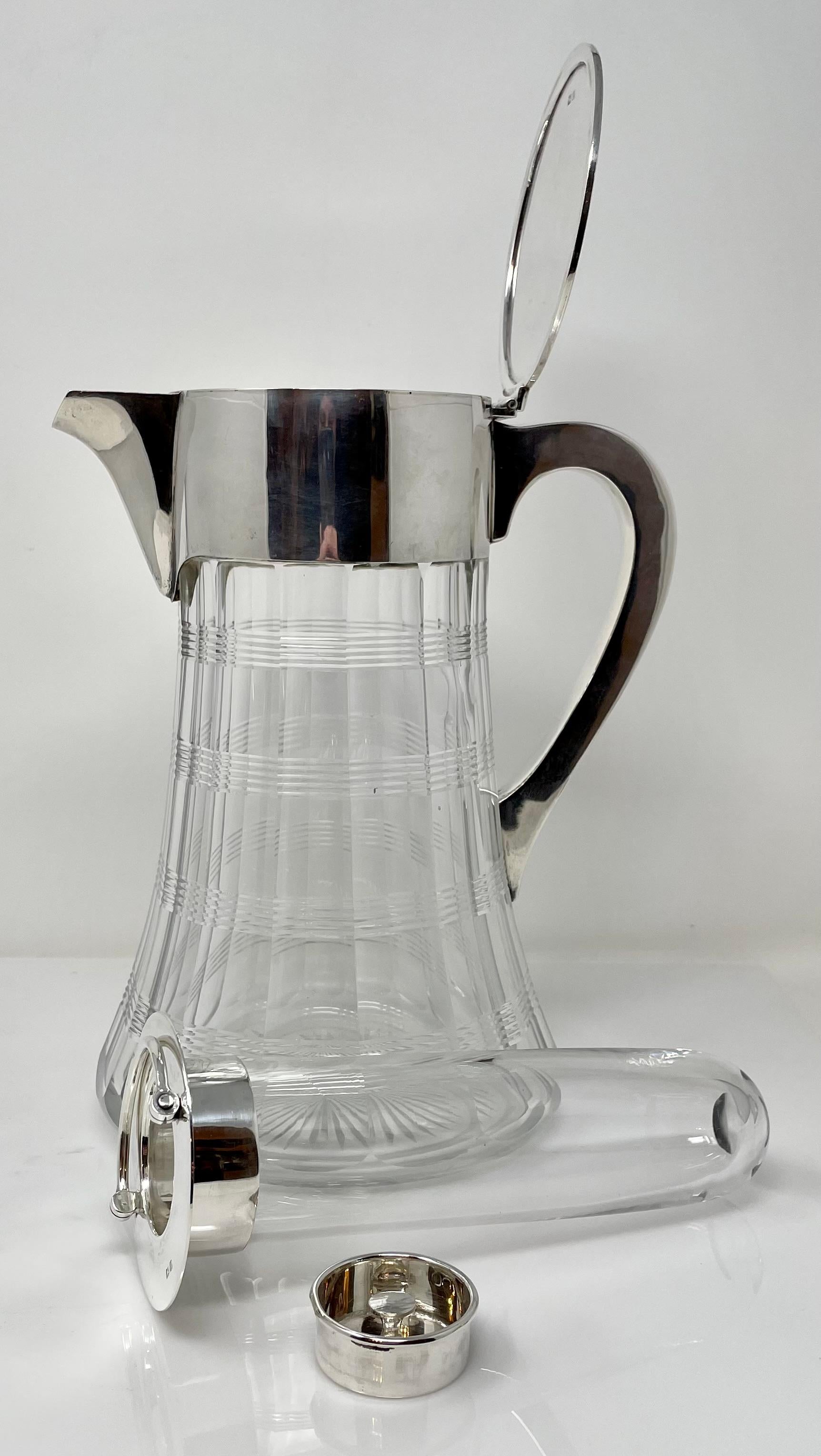 Large antique English cut crystal pitcher or jug with cooling apparatus and sterling silver mounts, hallmarked 