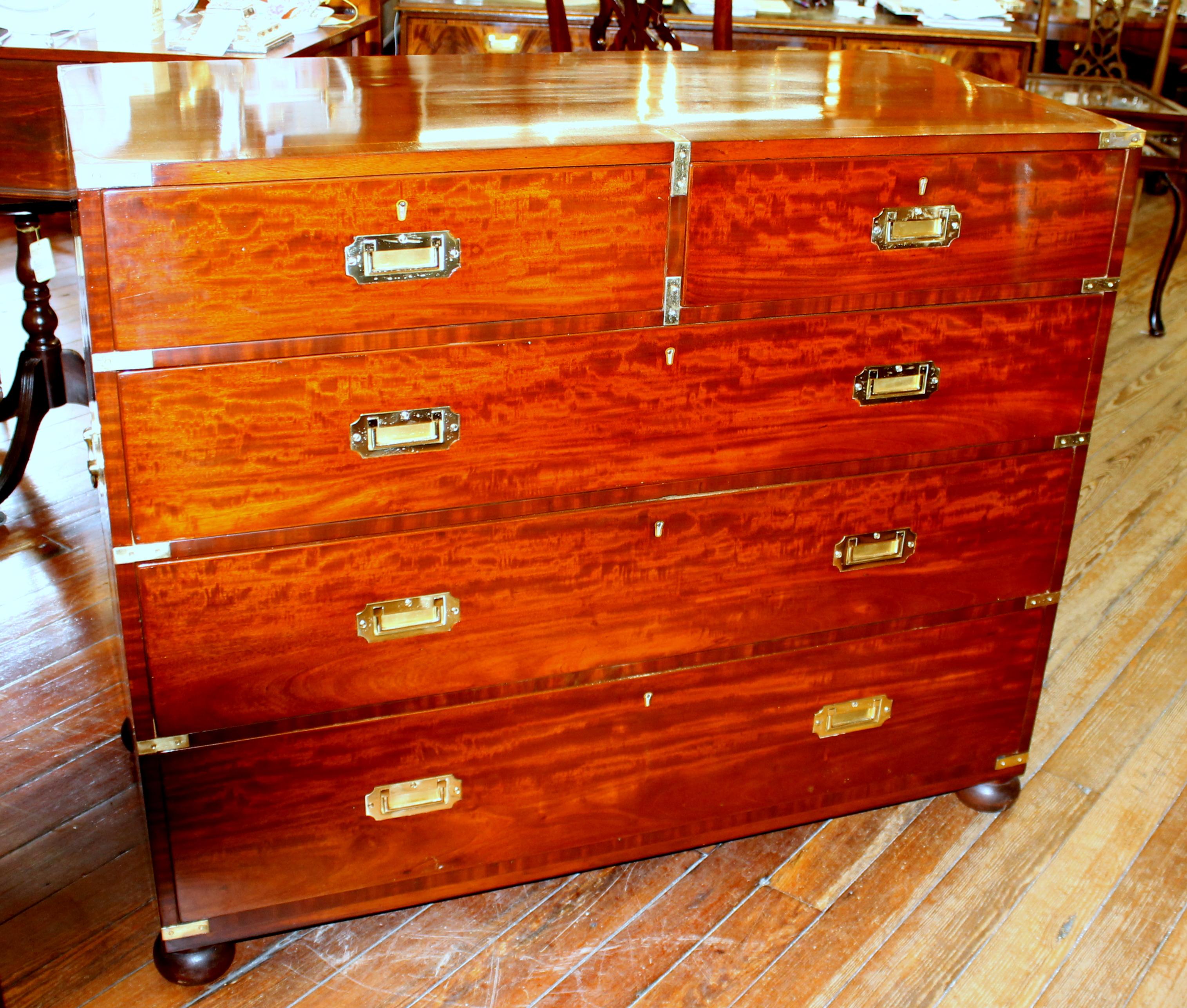 Rare and fine antique English rosewood cross-banded (Inlaid) and brass bound figured mahogany campaign or military style chest of drawers

Please note mahogany drawer linings and handsome inset campaign/military style cast brass hardware and cast