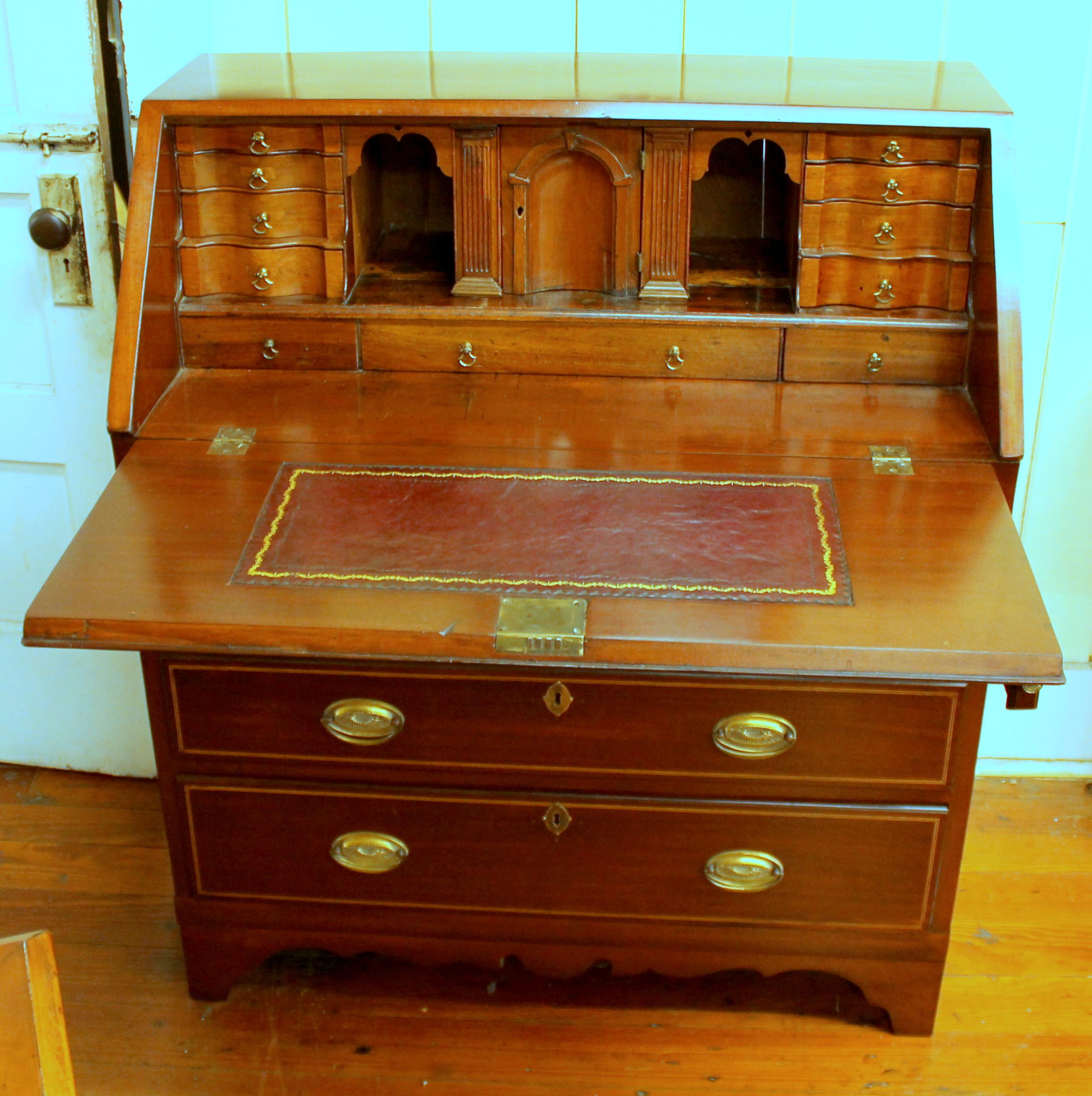 Fabulous antique English inlaid mahogany George III Slant-front Bureau with superb fitted interior. Please note the reeded columns to either side of the prospect door slide out to reveal 