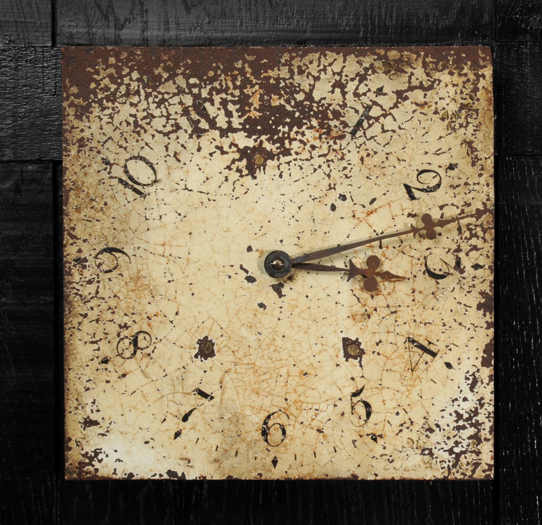 A lovely antique English iron clock dial dating from circa 1830. Found by our buyer in a derelict estate workshop. It shows the signs of long neglect, beautifully patinated with an ancient craquelure, paint loss and rust. The fine, once blued steel