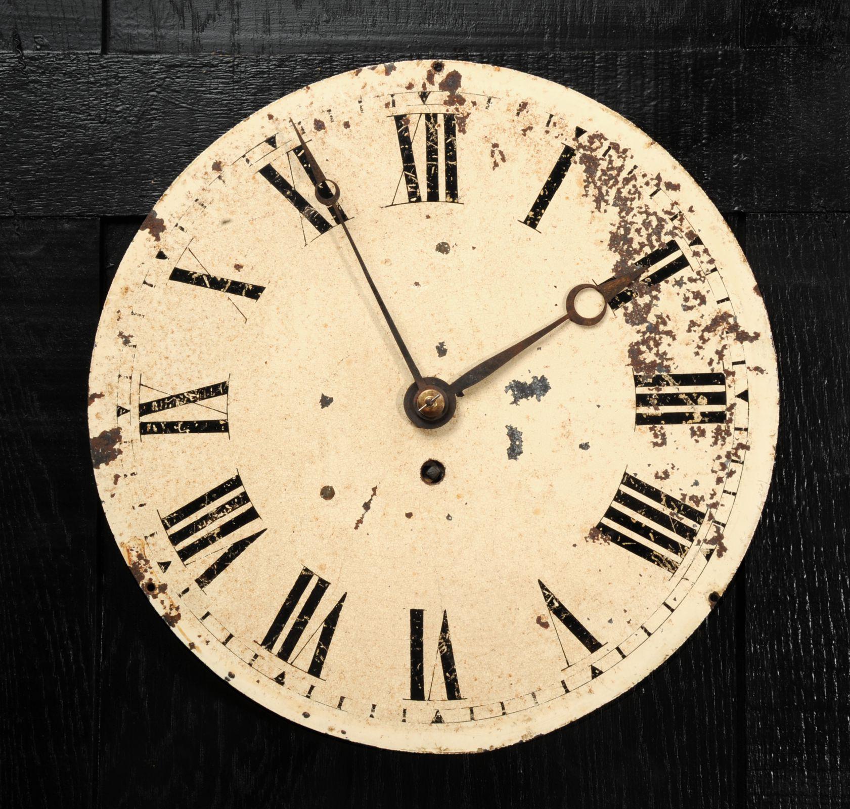 A lovely antique English iron clock dial dating from circa 1880. Reclaimed from a derelict Victorian works, it bears the scars of a hard life. Beautifully patinated with an ancient craquelure, paint loss and rust. The fine, once blued steel hands