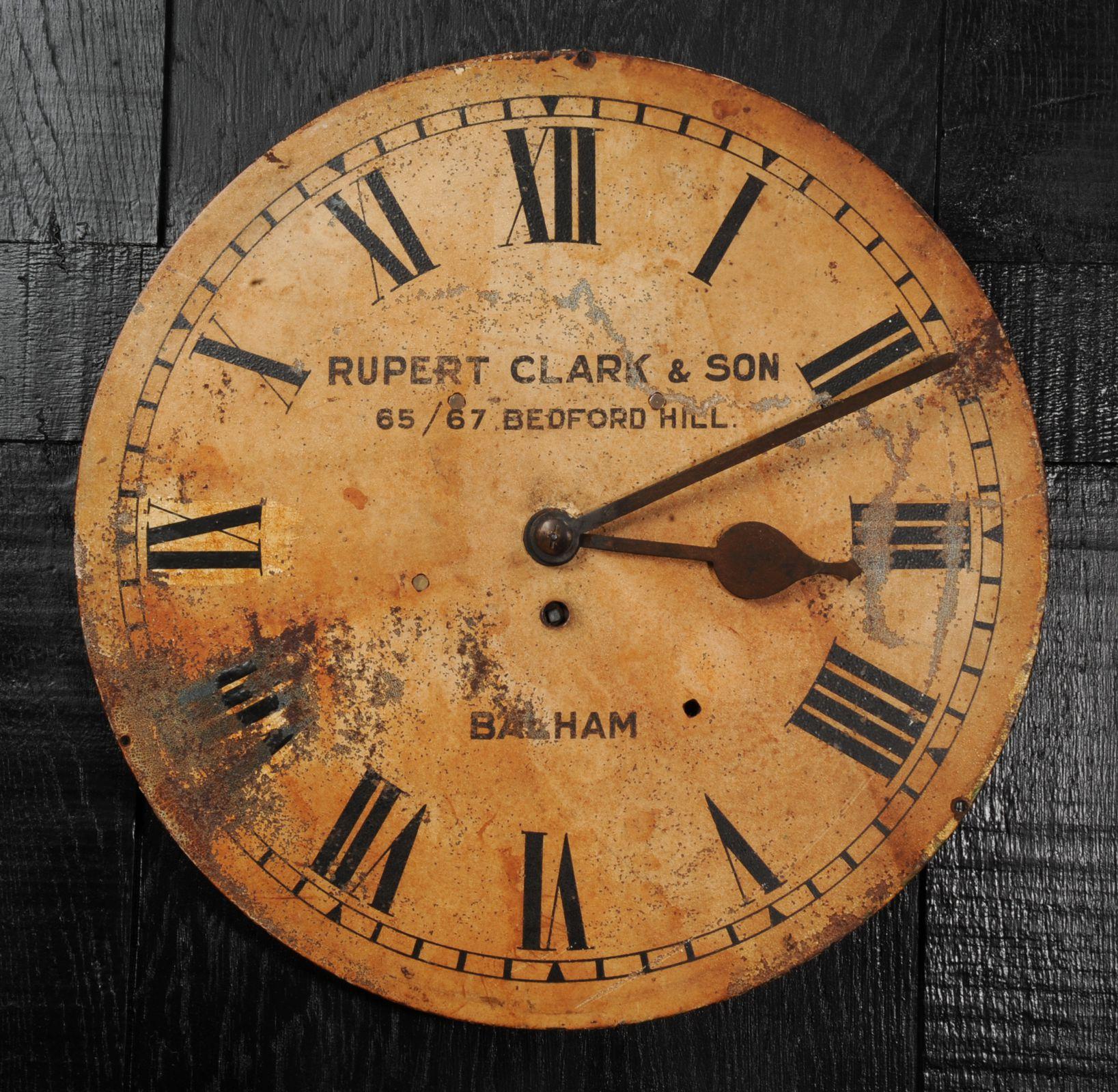 A lovely large antique painted iron clock dial signed 'Rupert Clark, & Son, 65/67 Bedford Hill, Balham' and dating from circa 1880. As reclaimed by our buyer from a derelict building, it bares the scars of a hard life. Beautifully patinated with