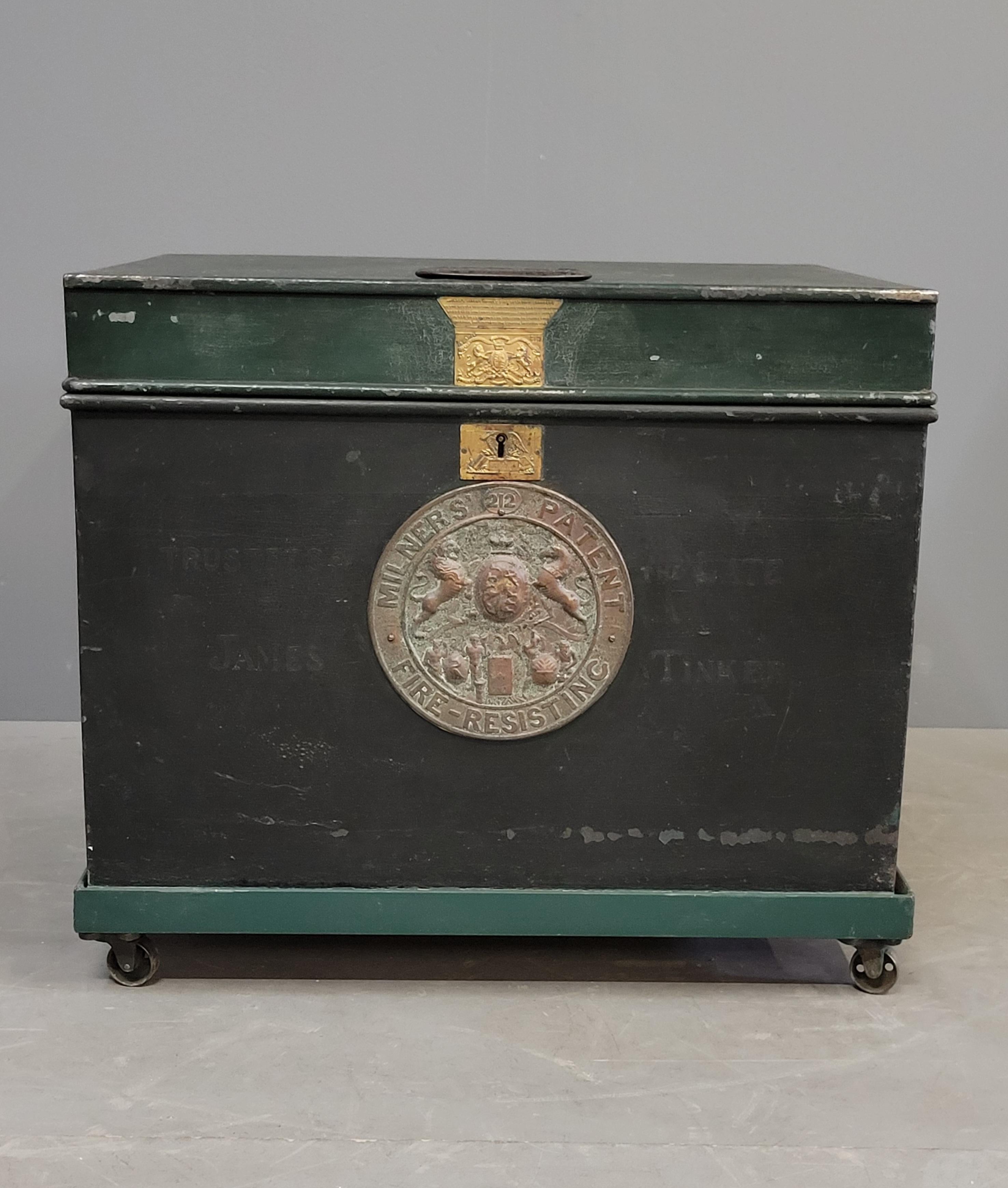 Antique late 1800s English iron Milner's Patent Fire Resisting Safe painted a gorgeous dark green with painted aqua interior. Gorgeous embossed brass circular plate and key plate with the English lion and unicorn crest. Milner's advertising sheet