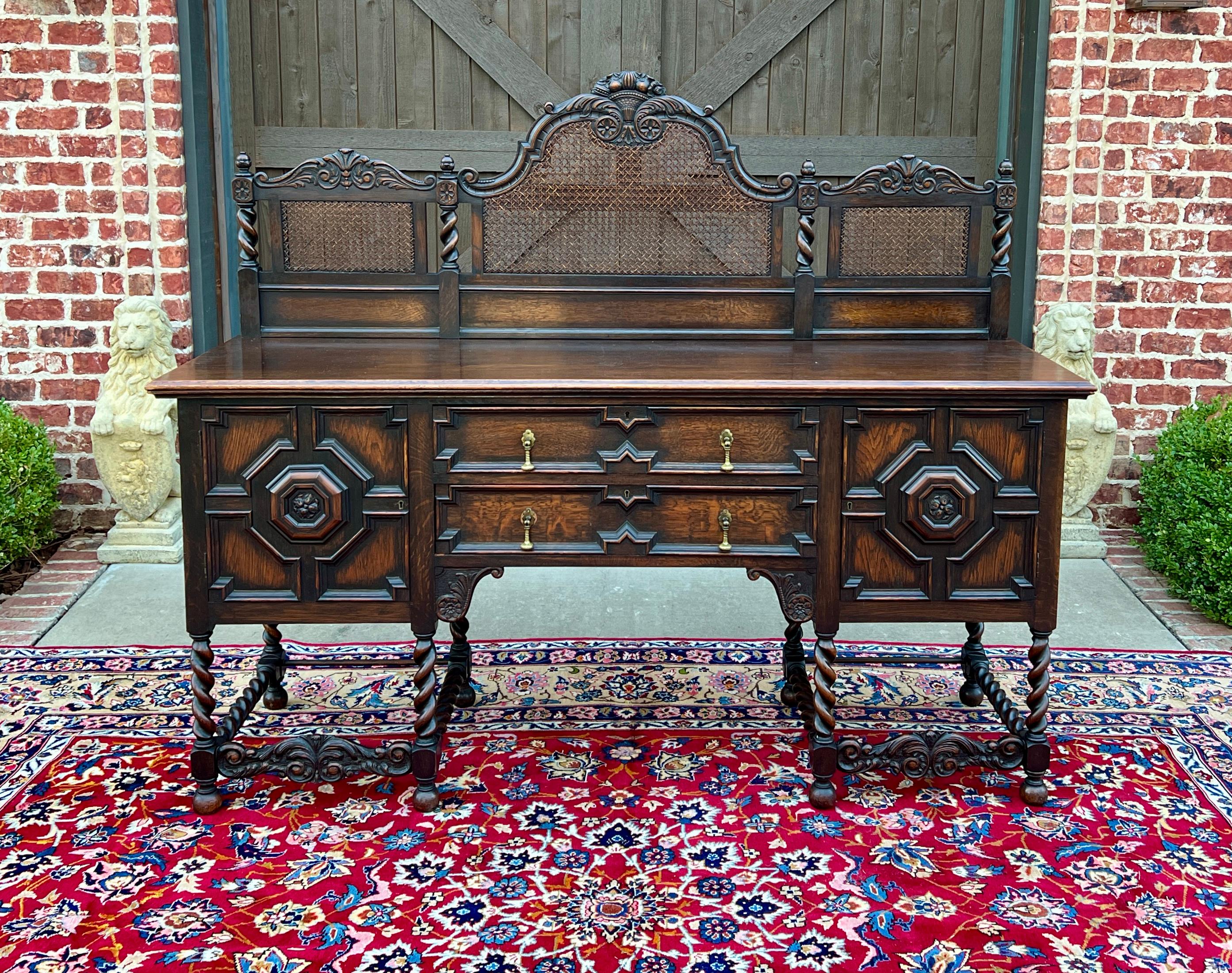     CHARMING Antique English Jacobean Oak Barley Twist Sideboard, Cabinet, Server or Buffet c.1920-1930s

    Barley twist legs with beautiful original caning backsplash ~~2 center drawers with original hardware and 2 cabinet doors~~one with pull