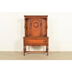 Antique English Jacobean Carved Oak Bar Cabinet, Circa 1920s