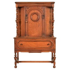 Antique English Jacobean Carved Oak Bar Cabinet, Circa 1920s