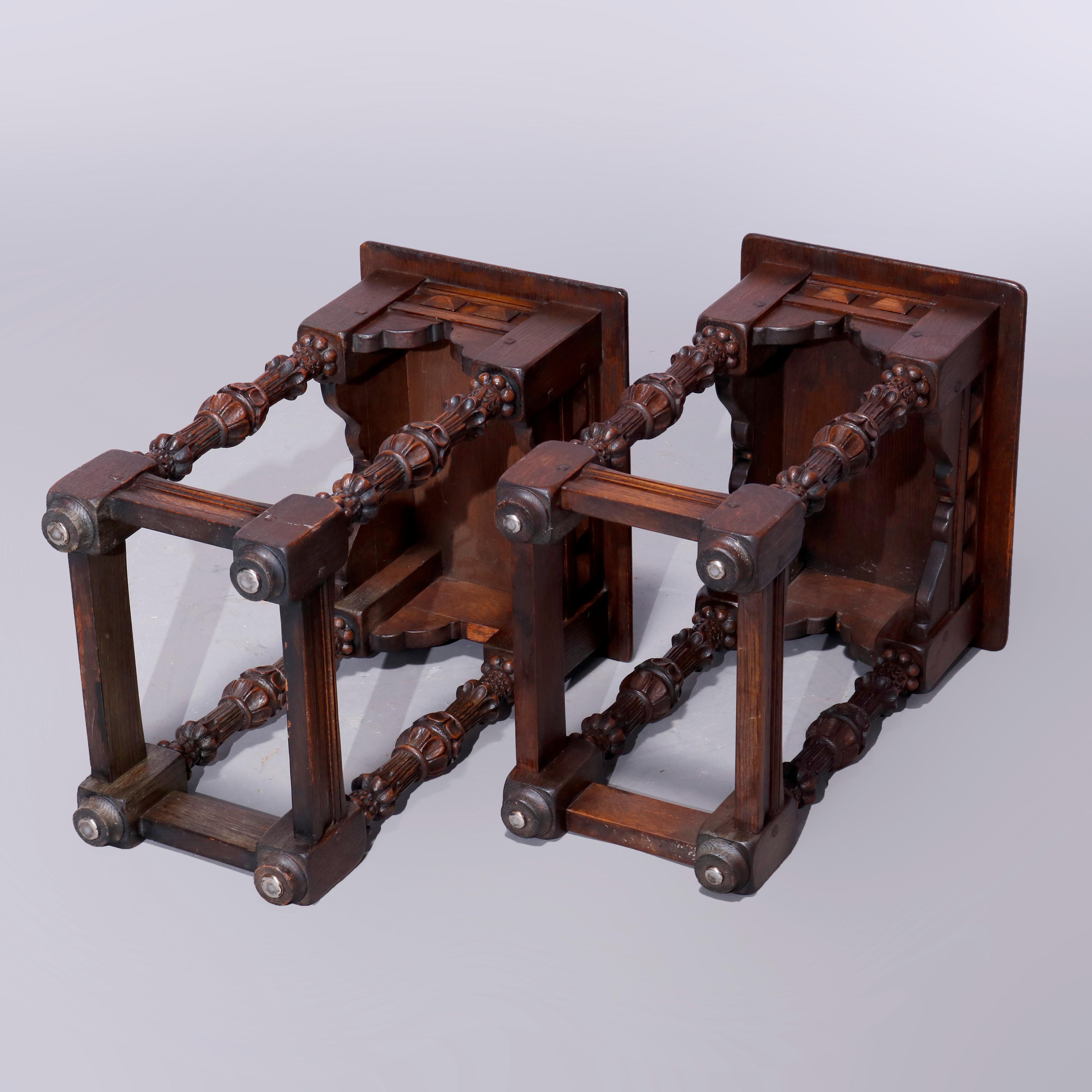 An antique pair of English Jacobean style side tables in the manner Kittinger offer oak construction with beveled tops over shaped skirts having pyramidal elements and raised on balustrade legs, c1920

Measures: 23.25