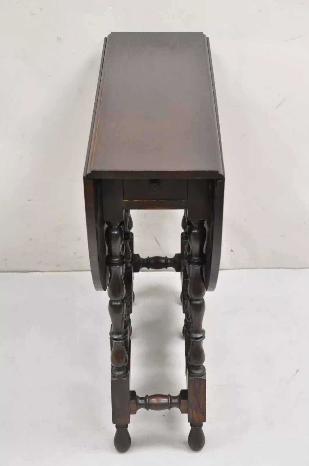 Antique English Jacobean Oak Wood Barley Twist Small Oval Drop Leaf Table In Good Condition In Philadelphia, PA