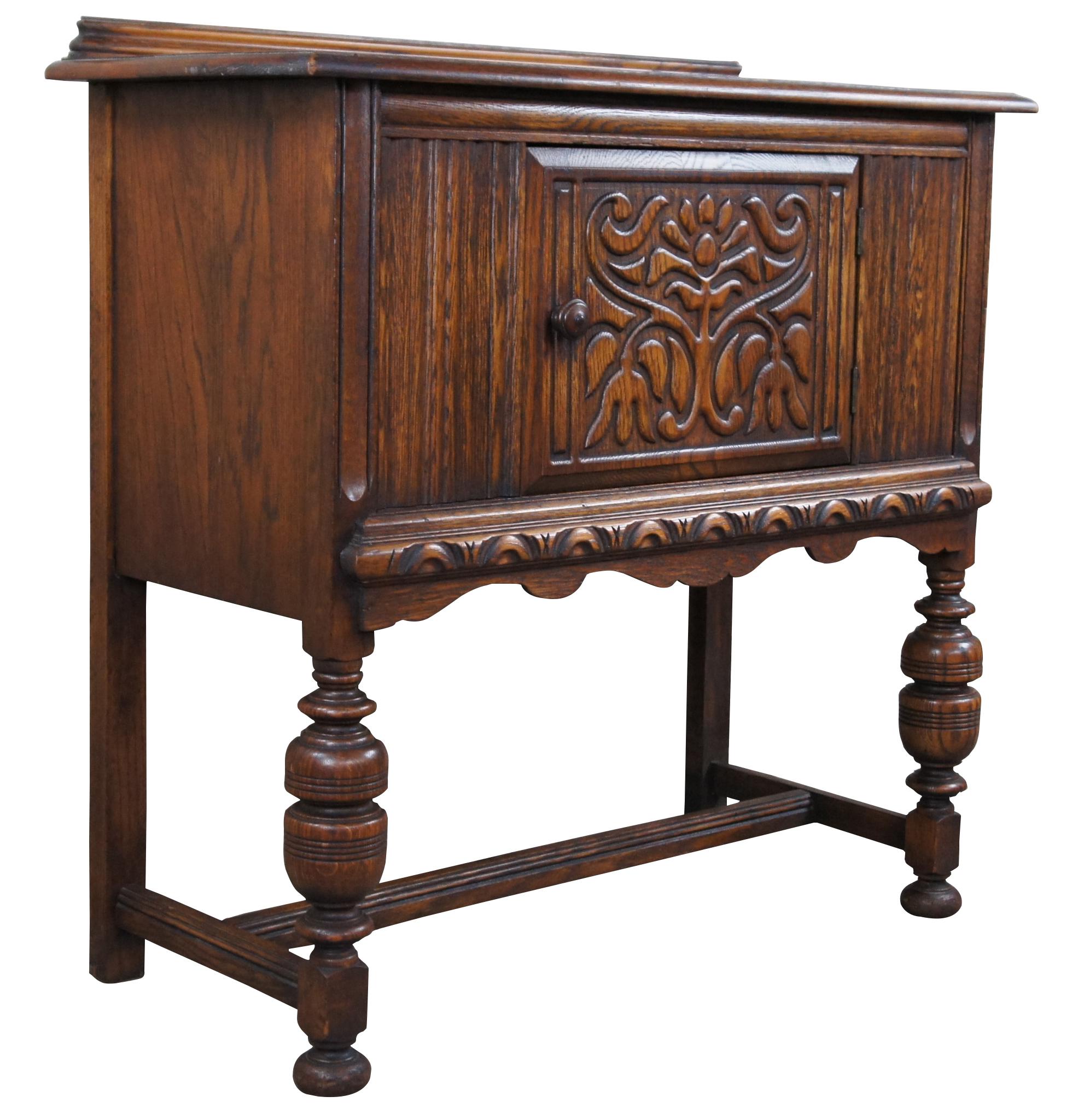 Early 20th century Jacobean / Elizabethan revival buffet or server. A rectangular form Made from oak with a carved central cabinet above a serpentine apron, turned baluster supports and bun feet connected by an H stretcher.
Measure: 36