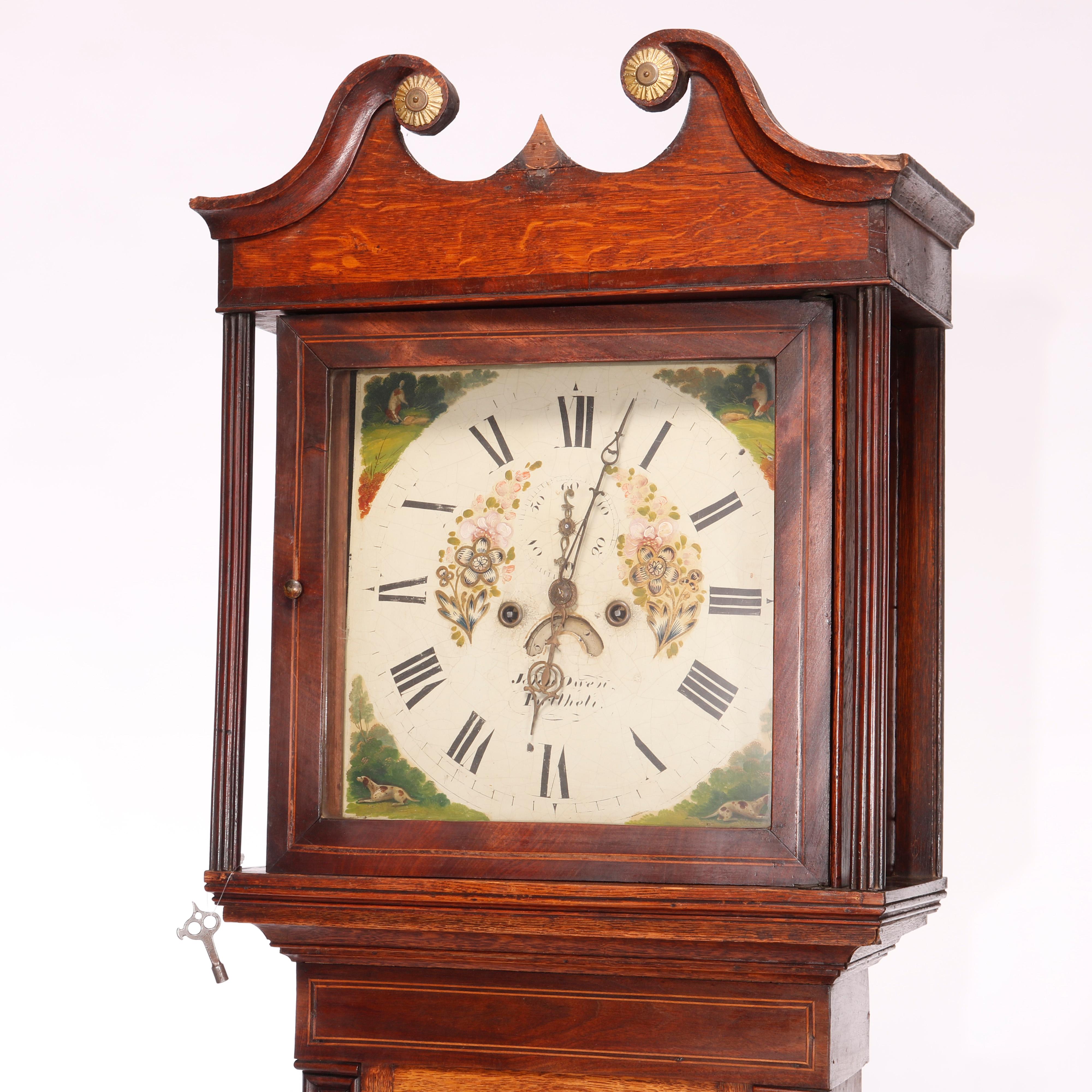 An English tall case clock by John Owen offers oak and mahogany banded case with broken arch crest over hand painted face with signature, non-working, c1820

Measures - 81.75'' H x 20.75'' W x 9.5'' D.