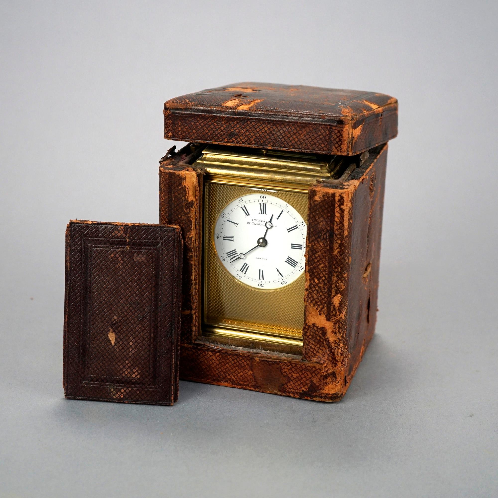 An antique English carriage clock with case by J.W. Benson offers brass case with beveled crystal sides, en verso maker mark as photographed, serial number 16223, working condition, and with original leather case, 19th C

Measures- 5.25''H x 3.5''W