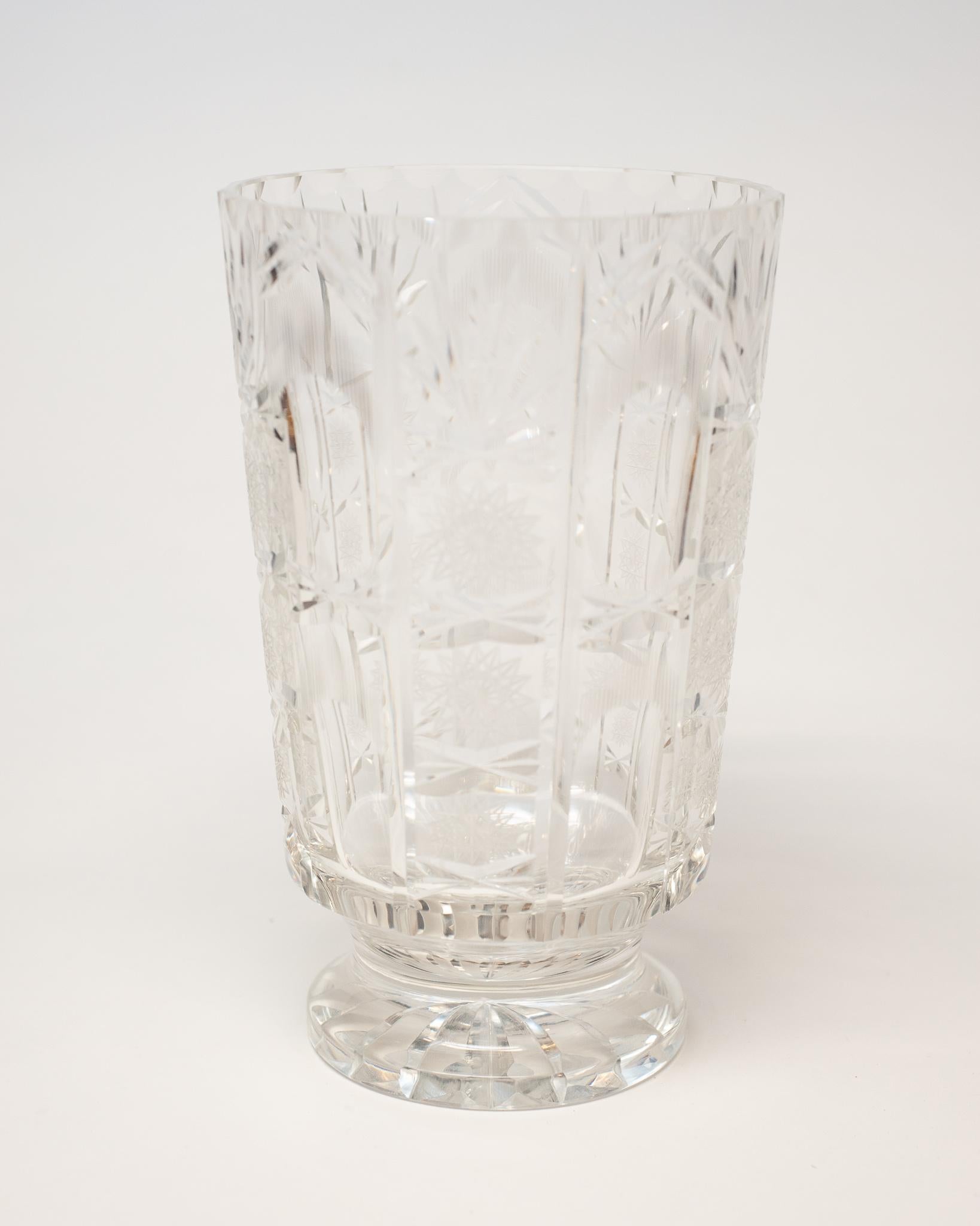 This antique Irish large cut crystal vase is a Classic accessory that is easy to place in any home.