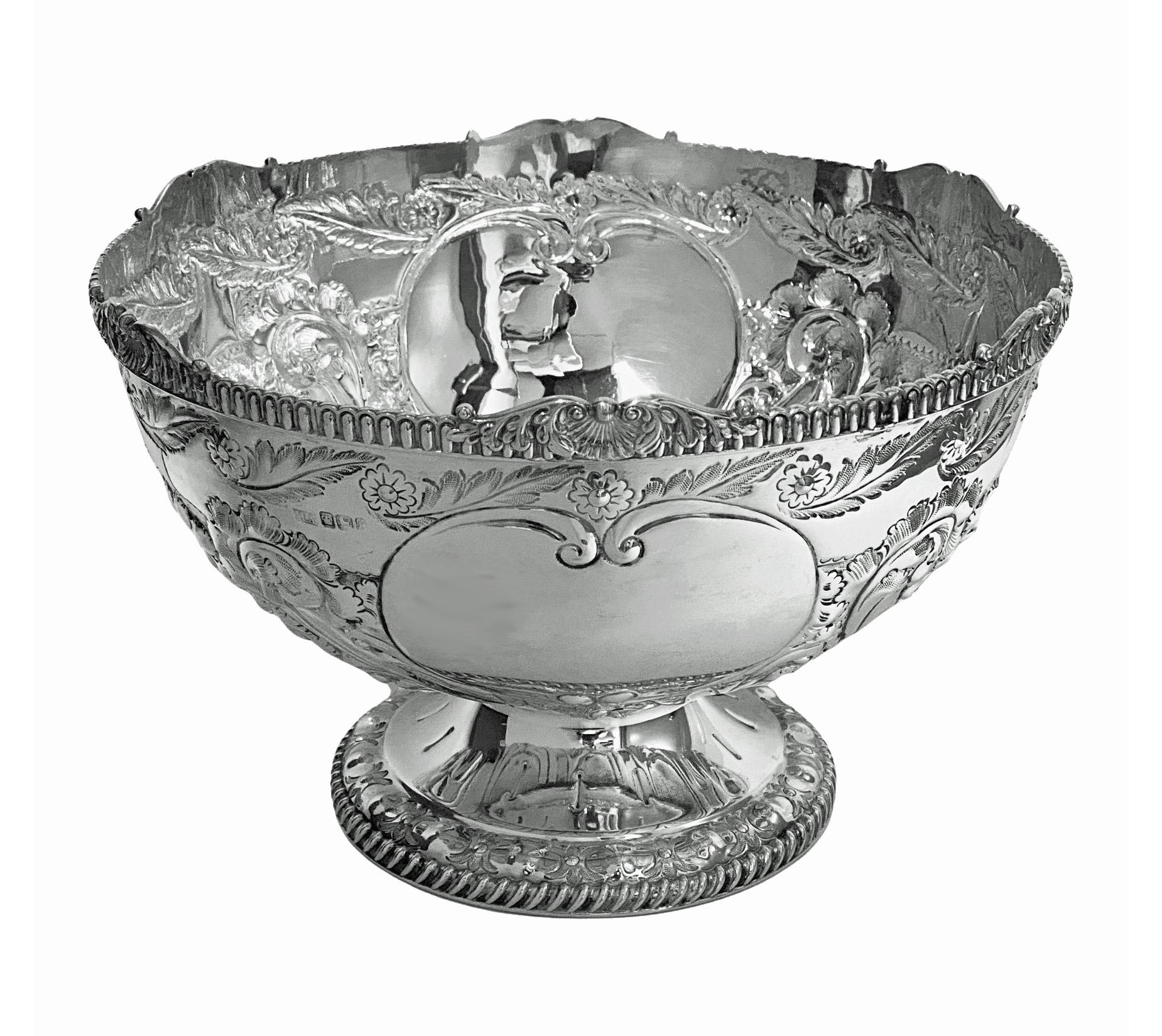 Antique English large Sterling Silver Bowl Sheffield 1895 Atkin Bros. Sterling silver, round, hand chased, footed bowl. The bowl beautifully hand chased and embossed on body and pedestal foot with floral and gadroon decoration. The body with two