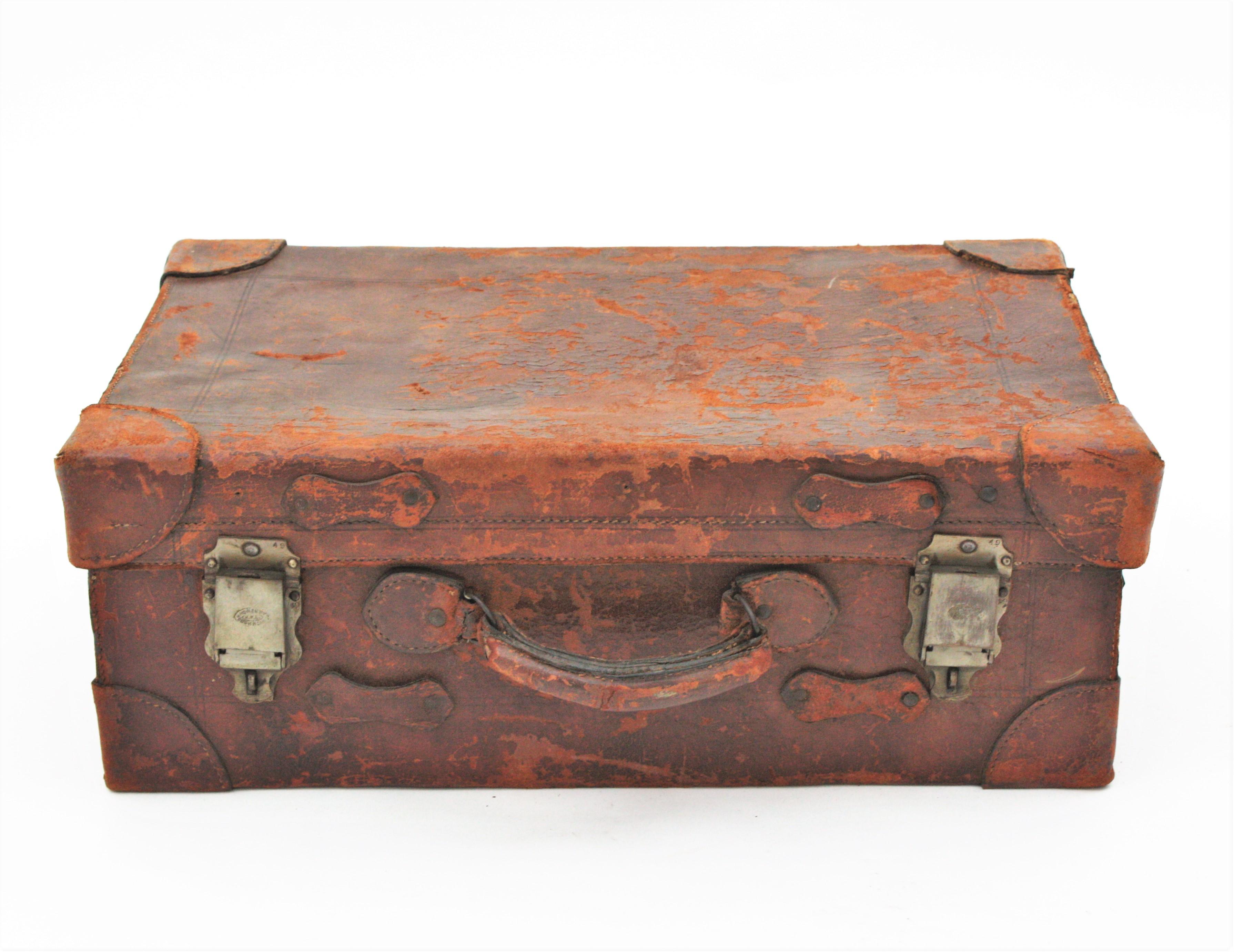 Leather suitcase, England, 1930s
It has leather handle and metal hardware. 
The small one is a travel suitcase with a gentleman vanity set inside. The large one is a travel suitcase with metal hangers.
 It can be used for storage or decorative