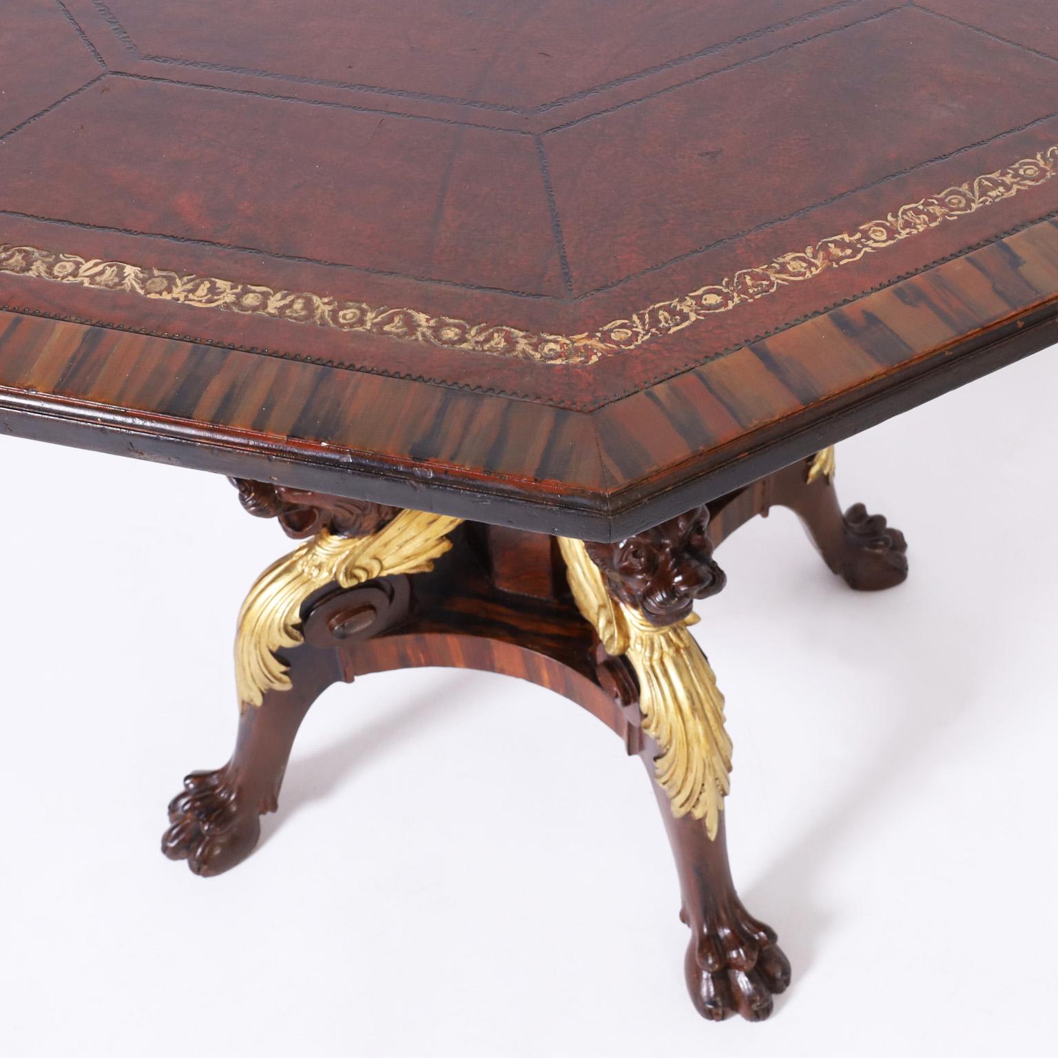 Carved Antique English Leather Top Center Table with Lion Heads For Sale