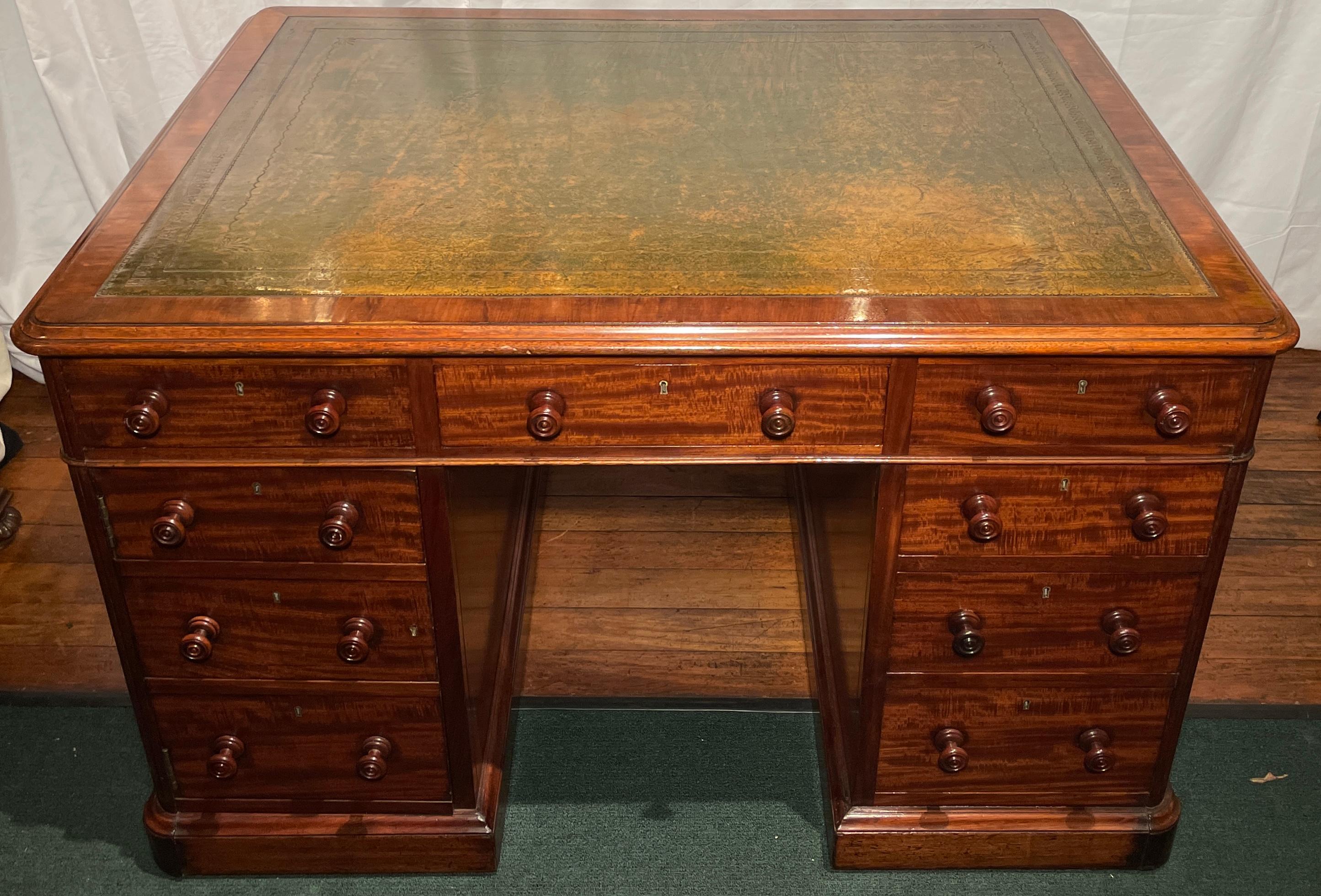 Antique English leather-top mahogany partner's desk, Circa 1880.