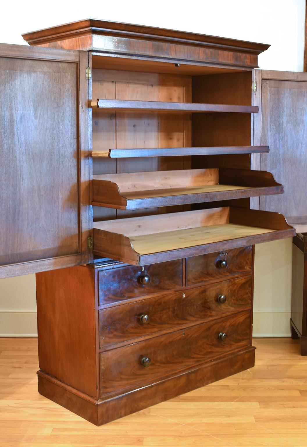 Polished Antique English Linen Press in West Indies Mahogany w/ Drawers & Enclosed Trays
