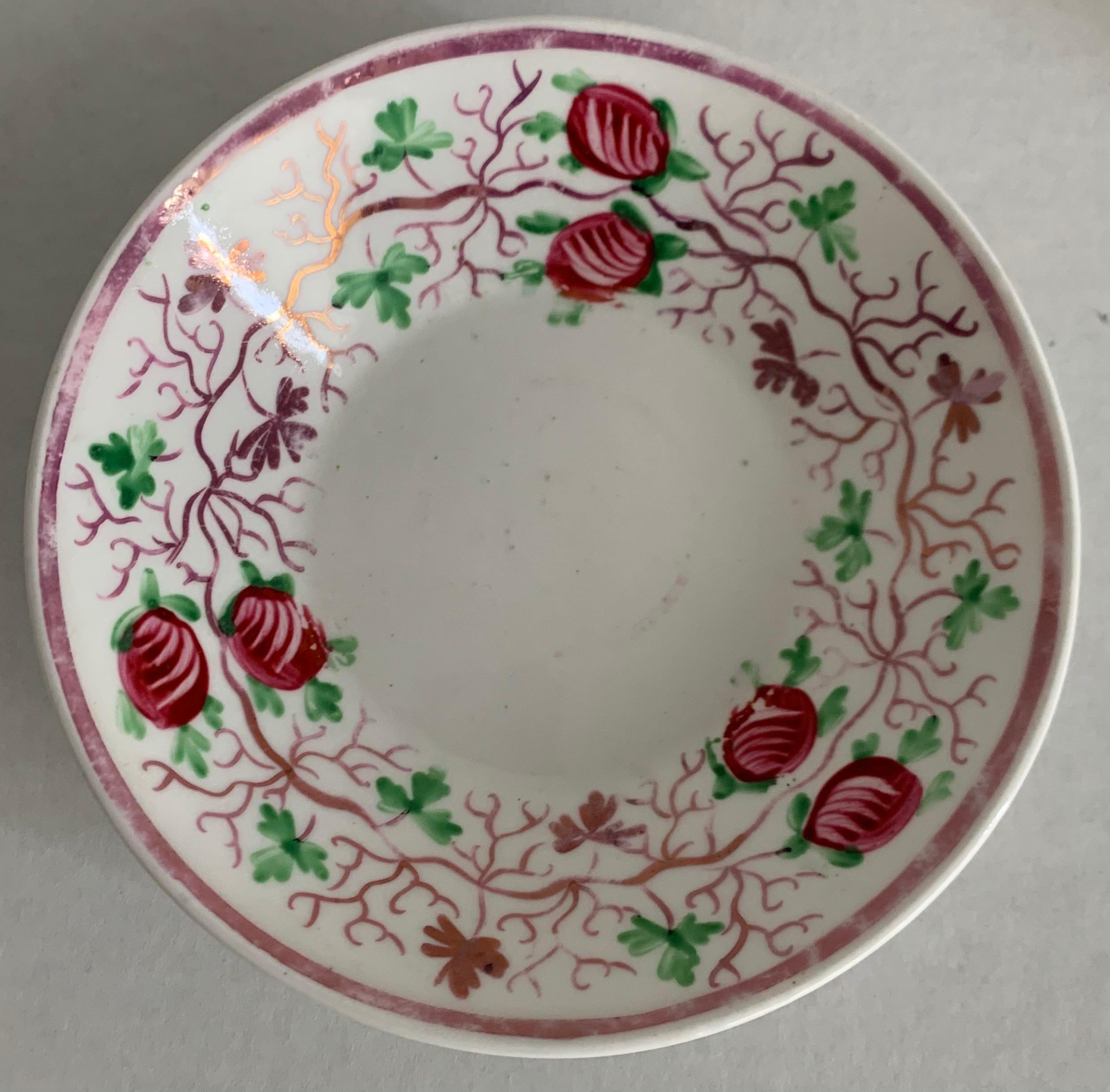 Late 19th century English soft paste porcelain lusterware saucer or trinket dish. Hand painted berry and vine motif. No makers mark or signature.
