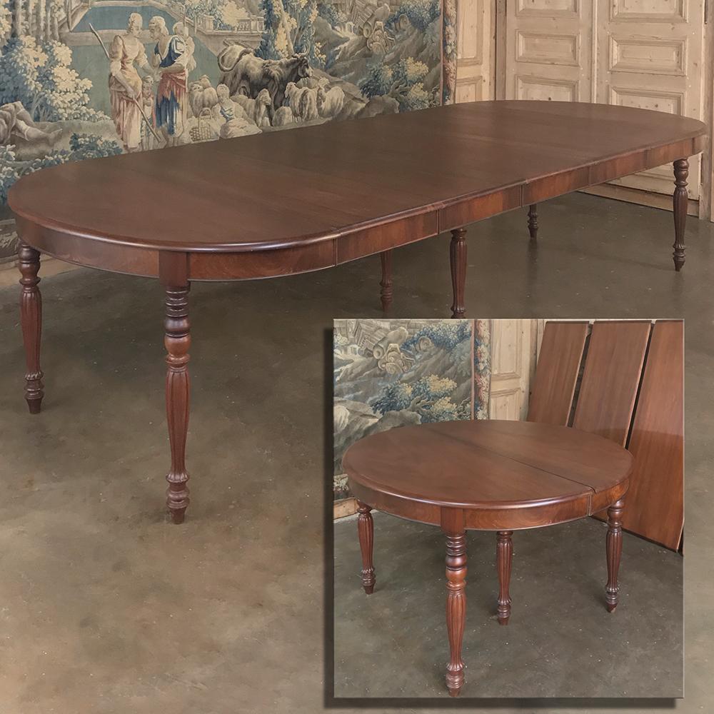 Antique English mahogany banquet table with 5 leaves is the perfect choice for those who have large families or entertain on a frequent basis. Each leaf allows two more guests to the table, so you have six configurations from which to choose! The