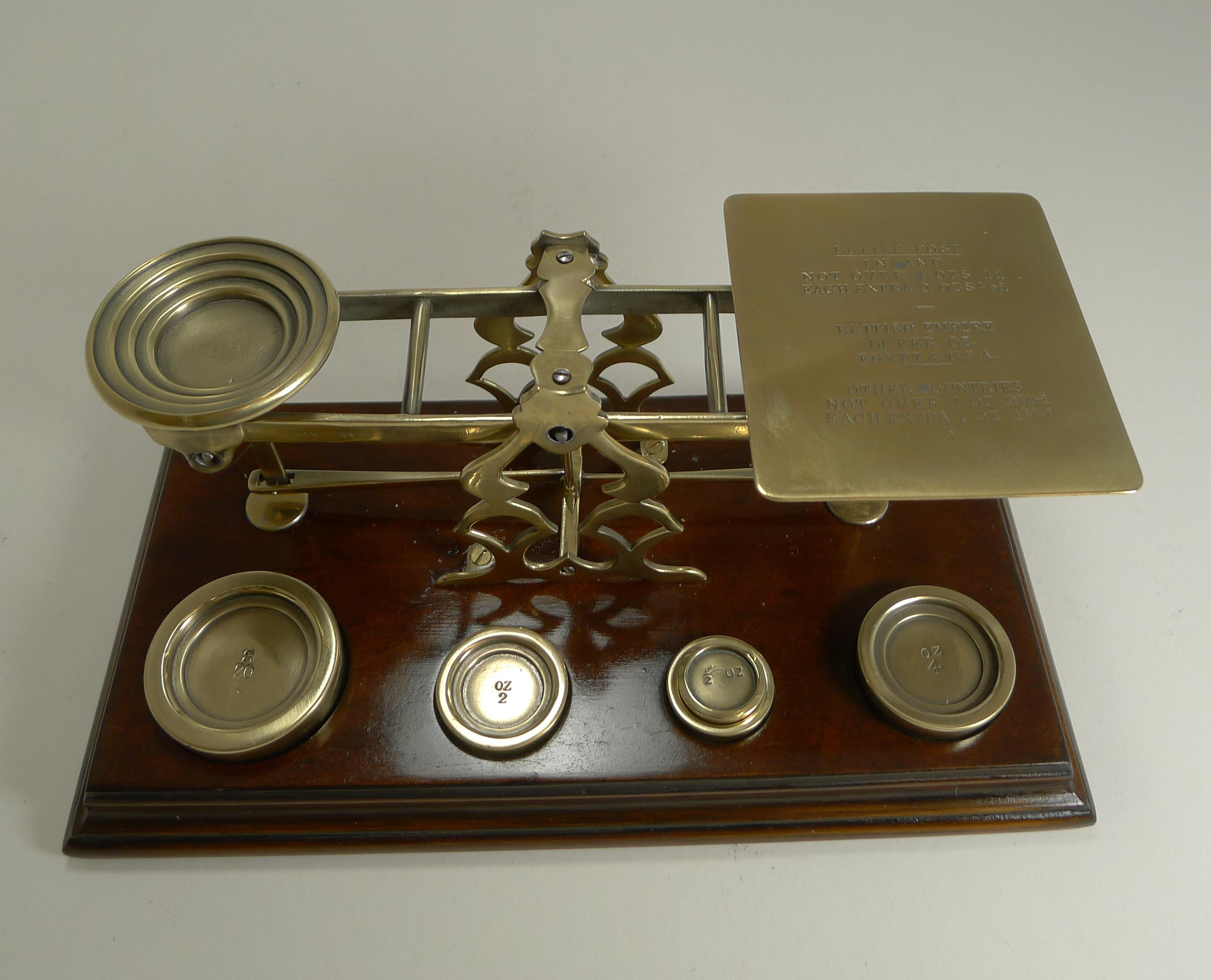 This wonderful pair of letter scales are by the very famous Sampson Mordan, the most highly sought-after maker, signed on the front, S.Mordan & Co. London.

The base is made from solid Mahogany and houses the set of five solid cast weights. The