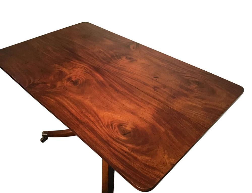 Antique English mahogany breakfast table.