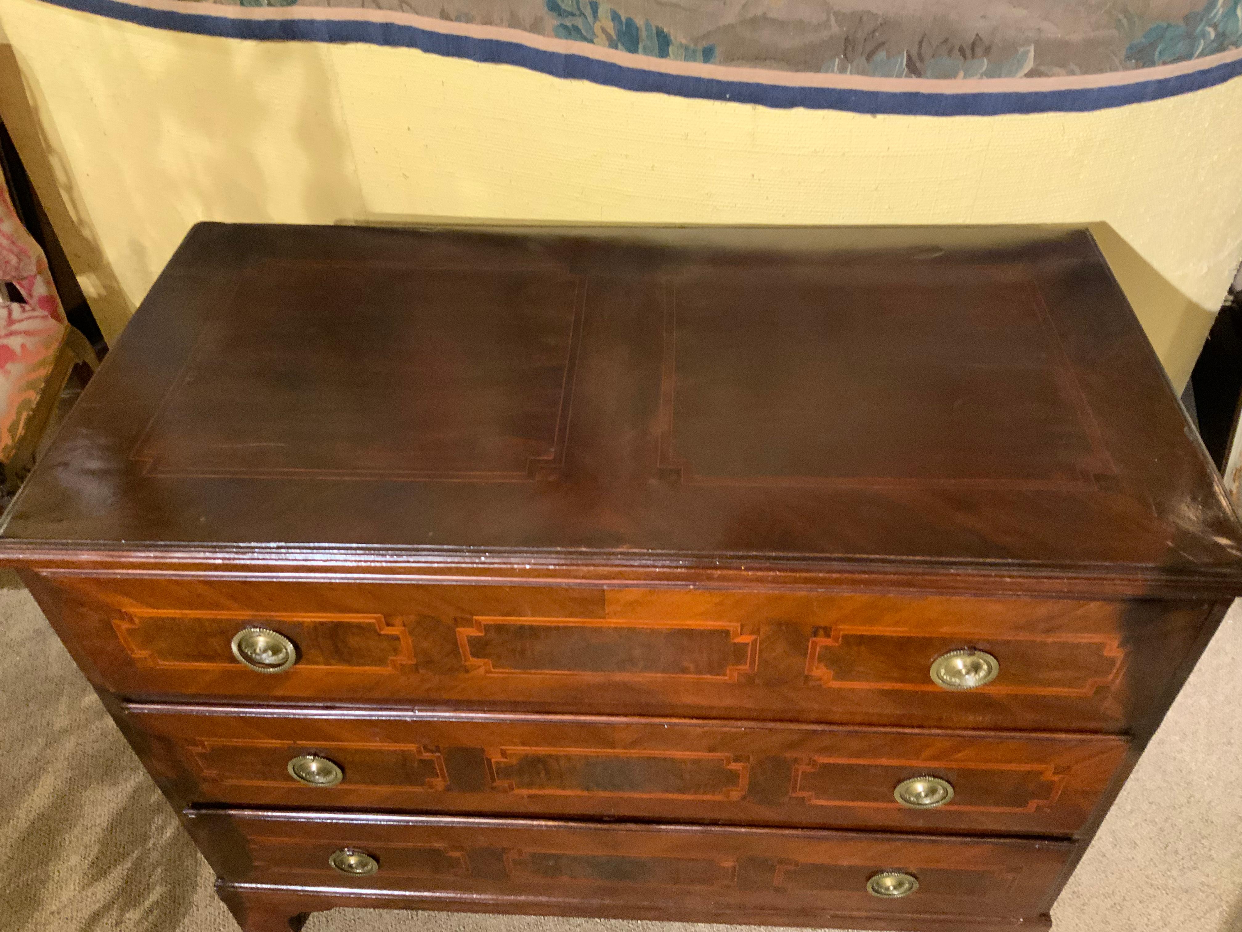 19th c. Chest with three deep drawers that slide easily. It has banding and designs in
Satin wood. Bracket feet.