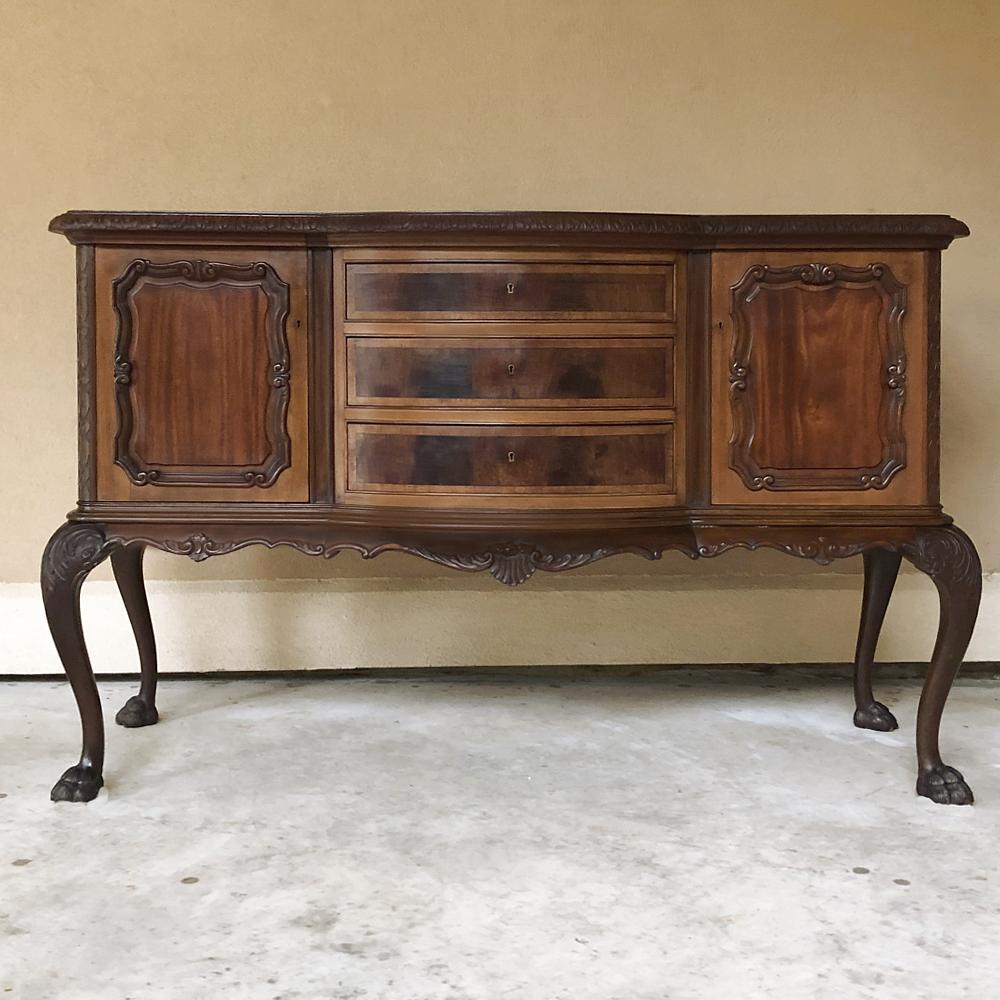 Antique English mahogany Chippendale low buffet ~ Sideboard is a classic rendition of the style, rendered in sumptuous imported mahogany and featuring scrolled legs with talon & ball feet, a contoured bow front facade with mahogany panels, and