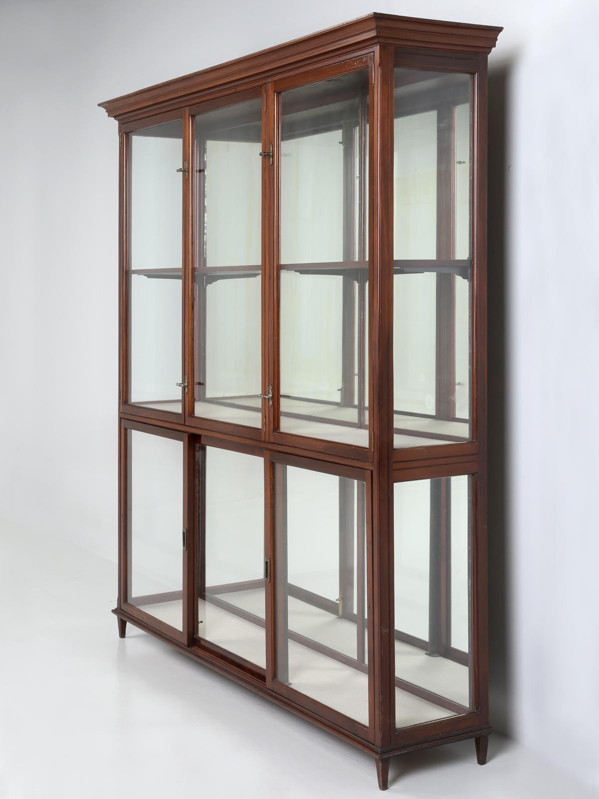 Antique English Display Cabinet or Curio Cabinet, that was most likely used in a Luxury Department Store and probably around the turn-of-the-century. I mention luxury, because of the unusual attention to detail, in which this display cabinet was
