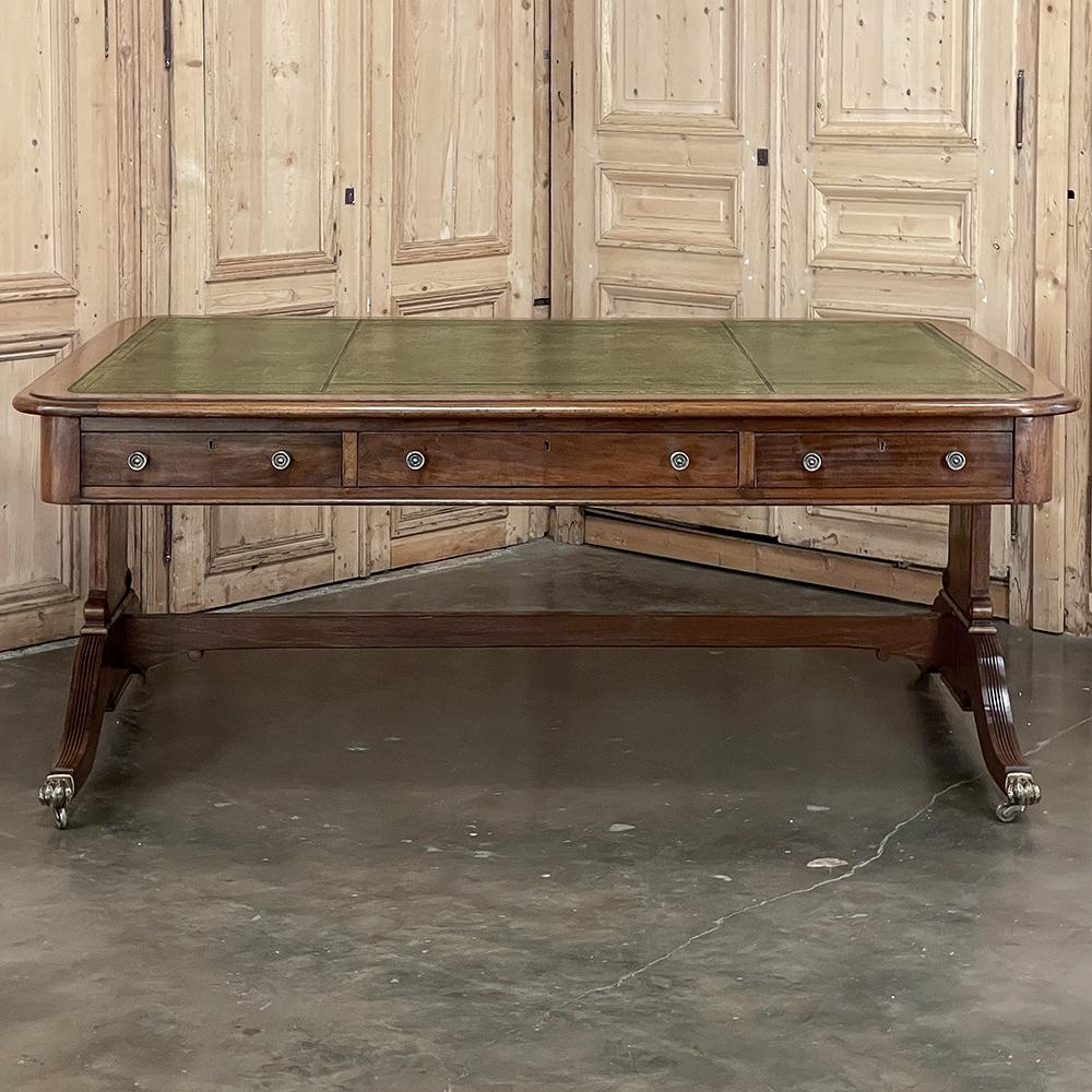 Antique English Mahogany Edwardian Partner's Desk with Leather Top will make the perfect centerpiece for an executive's enclave! Boasting over 30 square feet of total surface, most of which is covered with the original hand-tooled leather surface