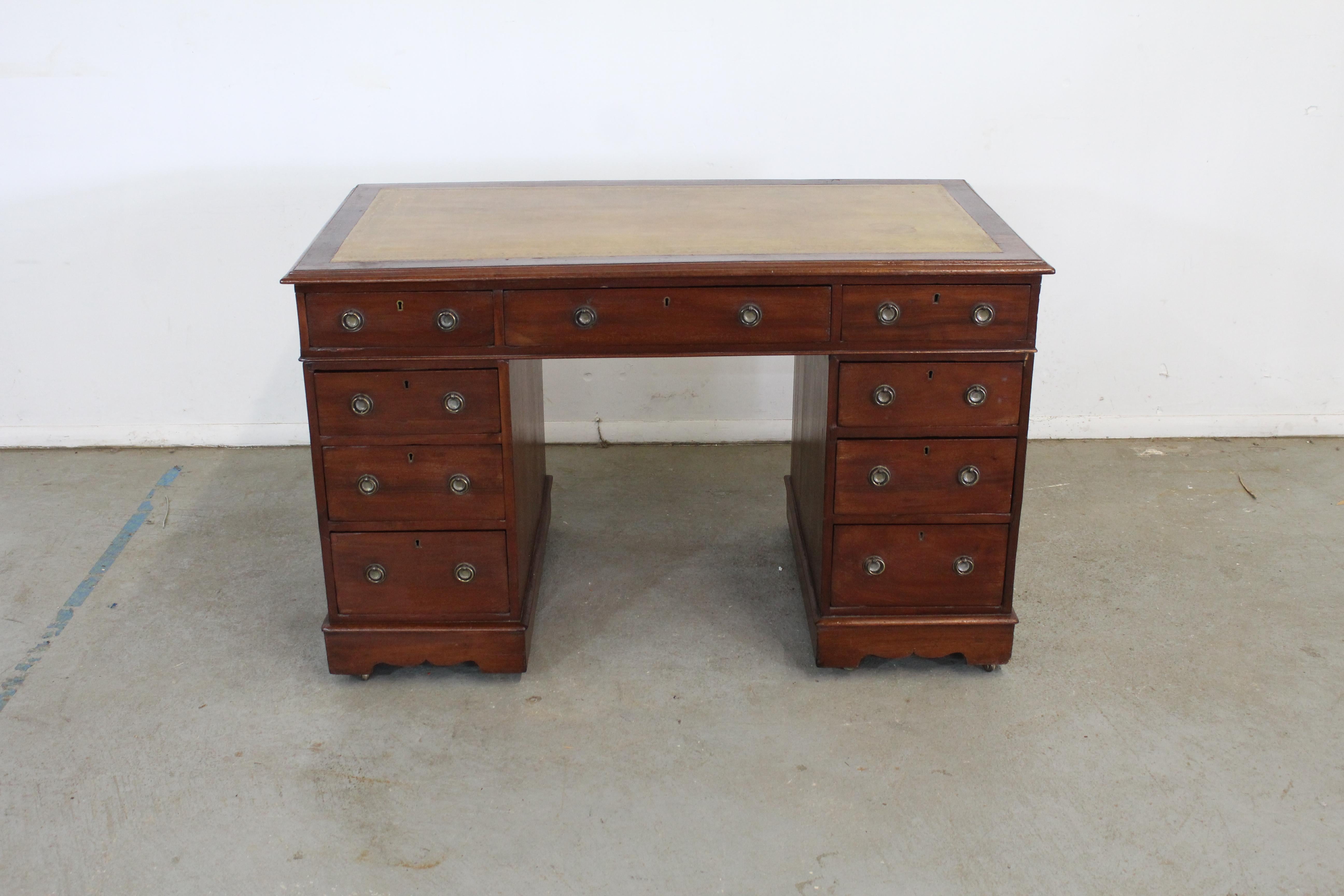 Antique English mahogany leather top pedestal desk




This is very well made and of excellent quality. Great size, and quite small proportions for a pedestal desk. The pedestals sit on bases with concealed casters, and this has beautiful solid