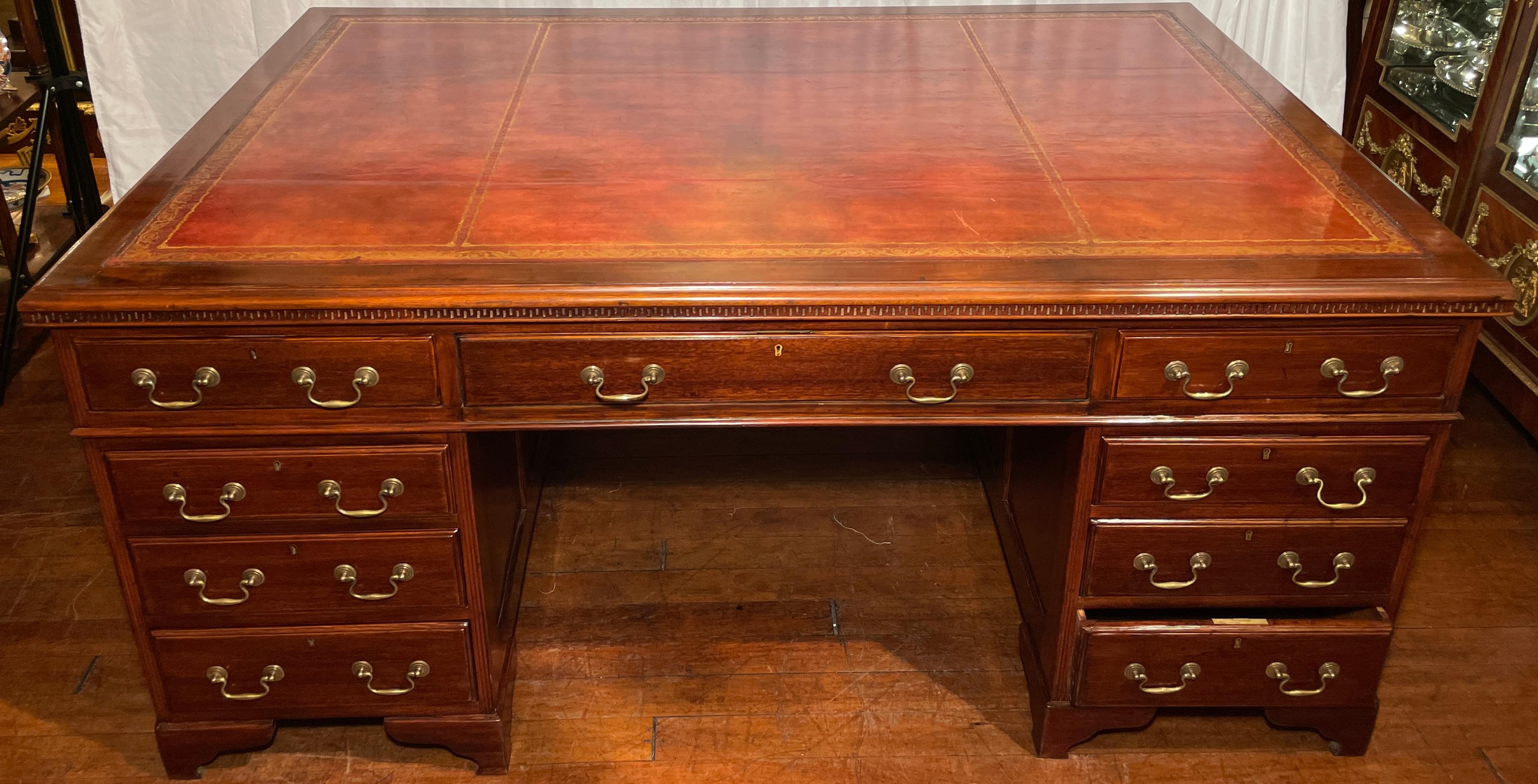 Antique English mahogany partner's desk with leather top, circa 1880. 