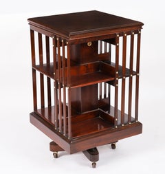 Antigua librería giratoria inglesa de caoba de Maple & Co. Circa 1890
