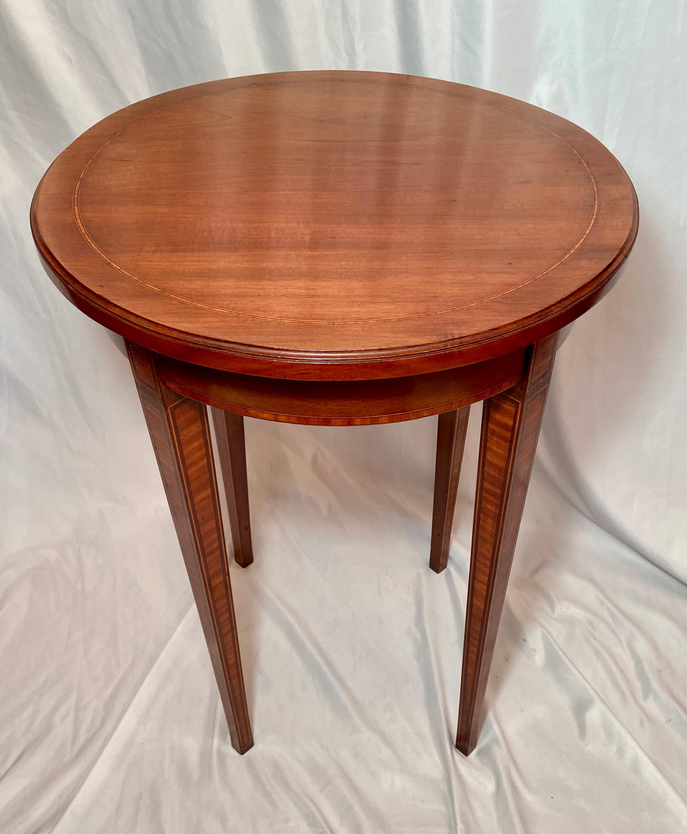 Antique English mahogany table with satinwood inlay, Circa 1880-1890.