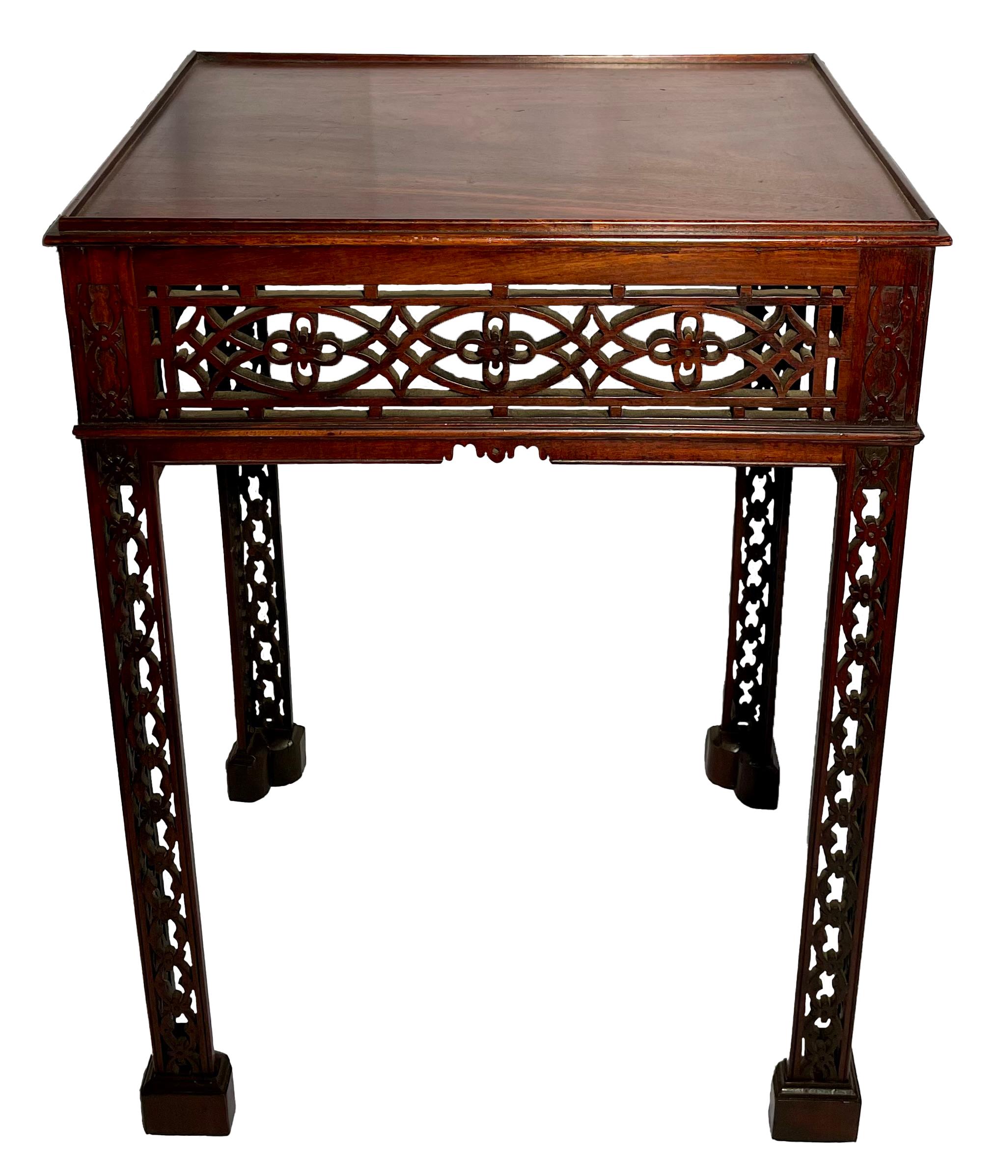Antique English Victorian mahogany tea table with Chippendale fretwork, circa 1880.