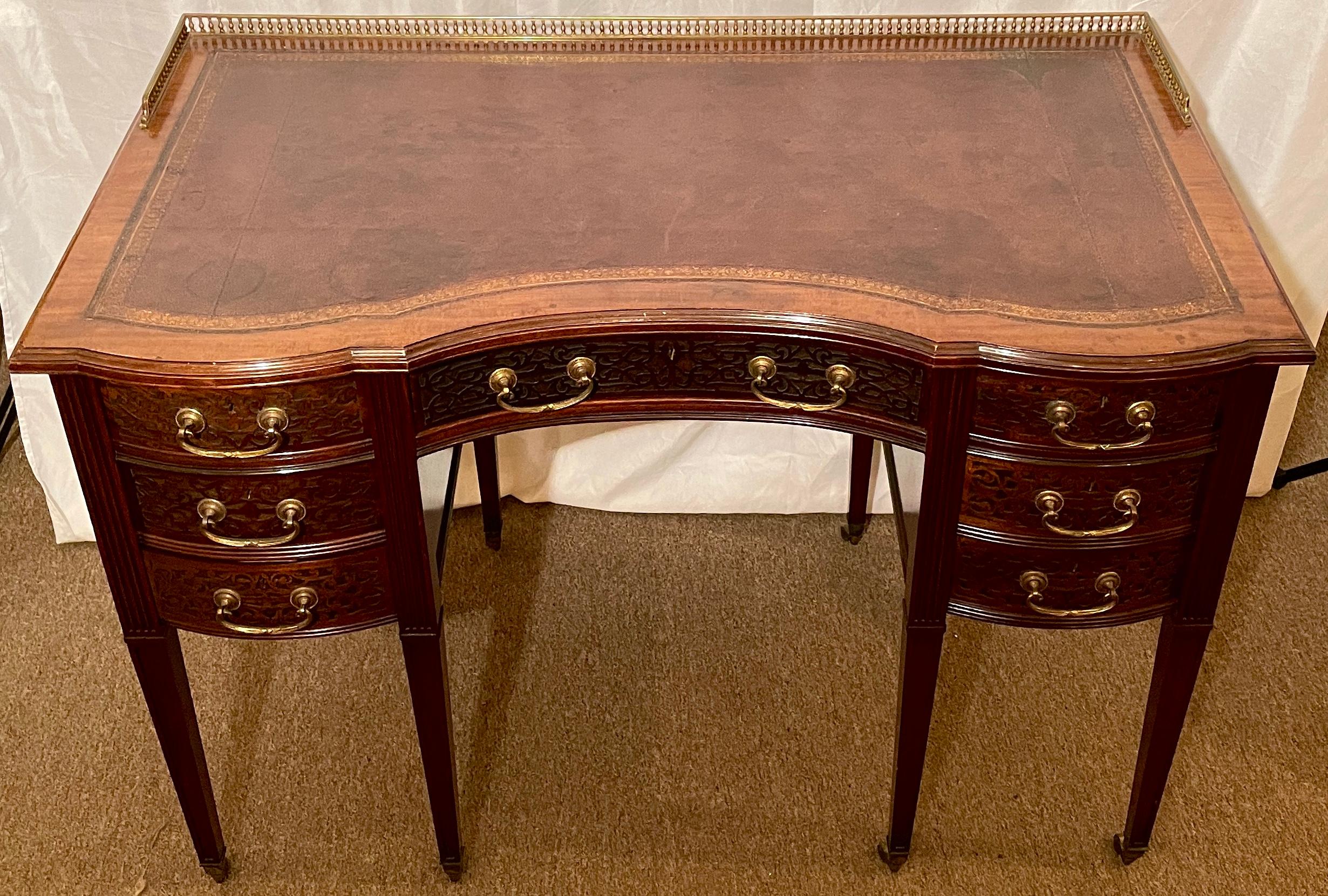 Antique English mahogany writing desk with Chippendale fretwork and Galleried top, circa 1880. Made by Edwards & Roberts.