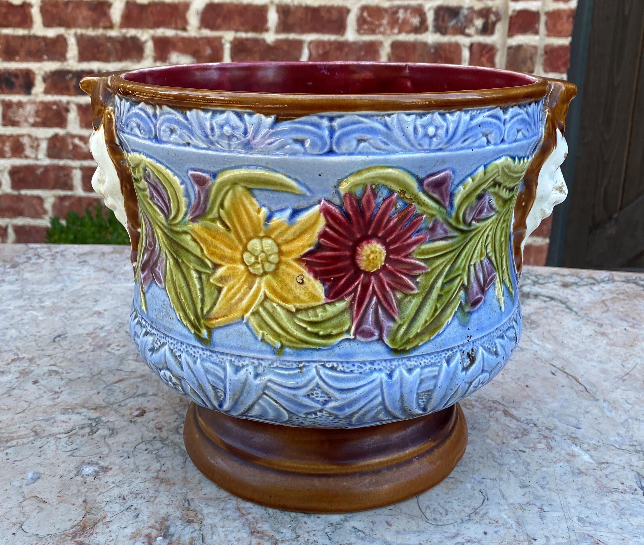 Gorgeous large antique English Majolica cache pot, planter, jardiniere, flower pot or vase~~Art Nouveau~~c. 1900

Authentic English Majolica planter or cache pot~~vibrant light blue background with green, yellow, maroon and purple floral