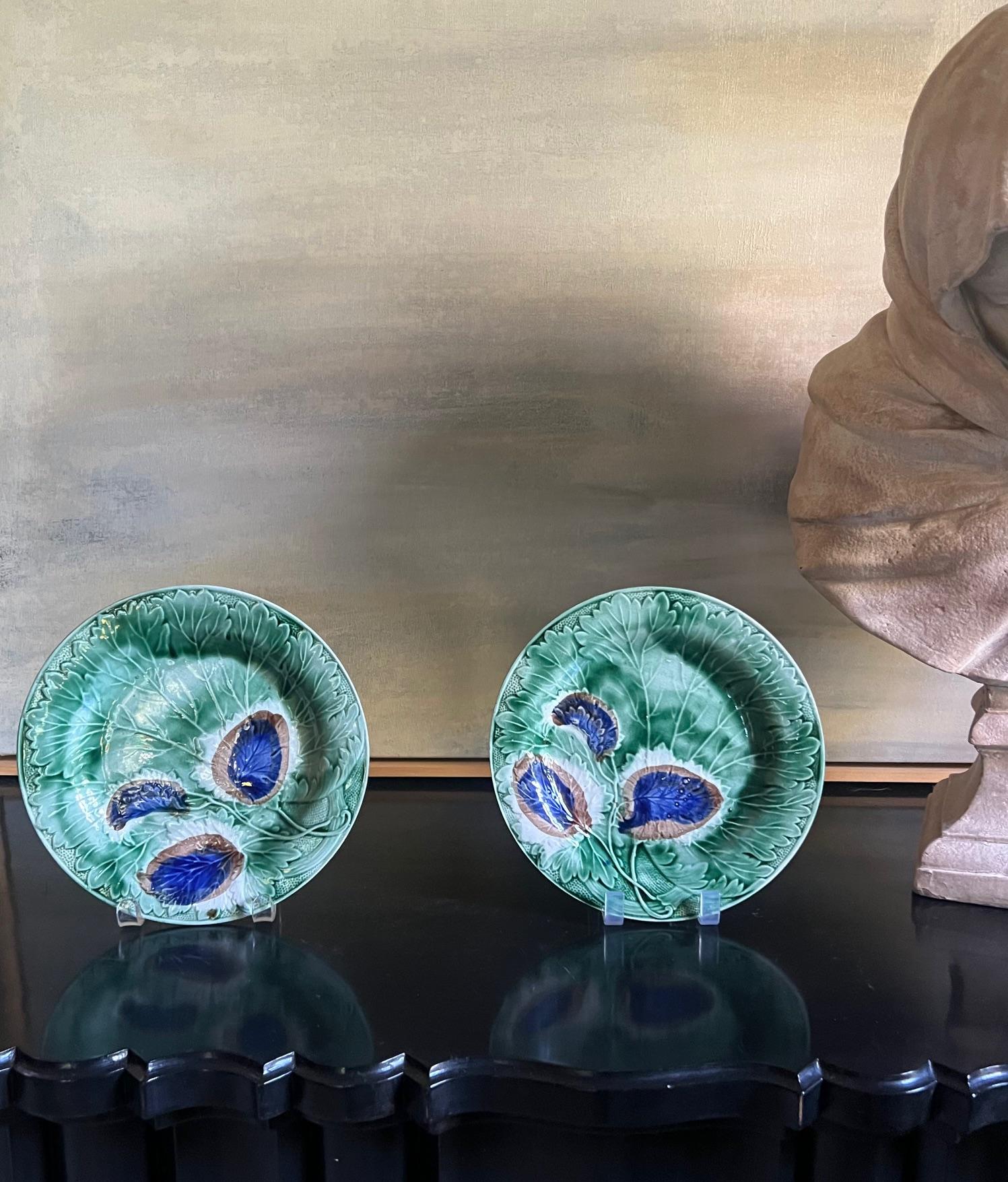 Green majolica plate covered in leaves and flowers, made in England around the 1920's.