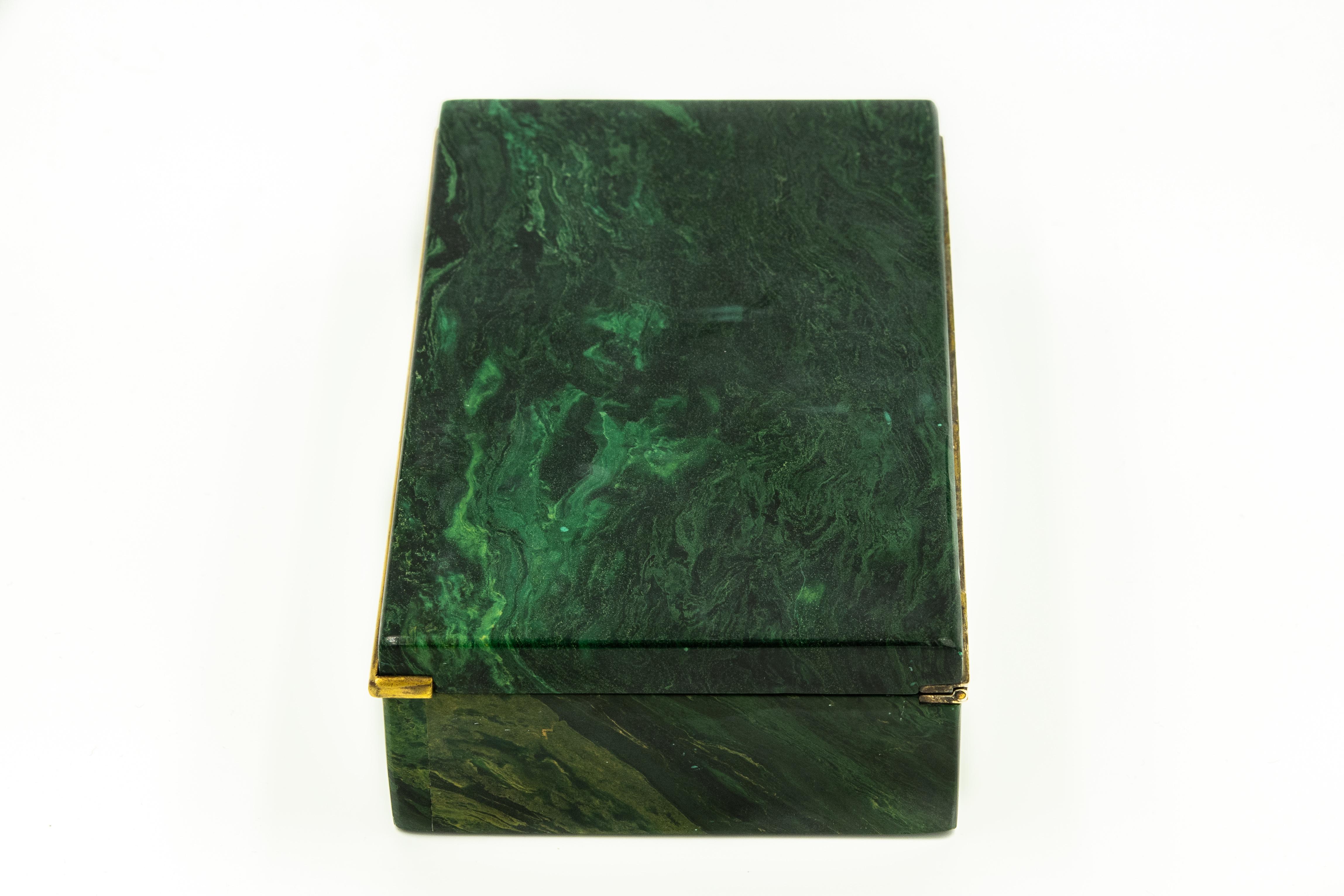 Gorgeous English malachite and gilt sterling silver box that would be perfect to store jewelry, cigarettes, cigars or trinkets. Beautifully constructed of green malachite with gilt sterling silver hinge and accent lid lip. The box was made by
