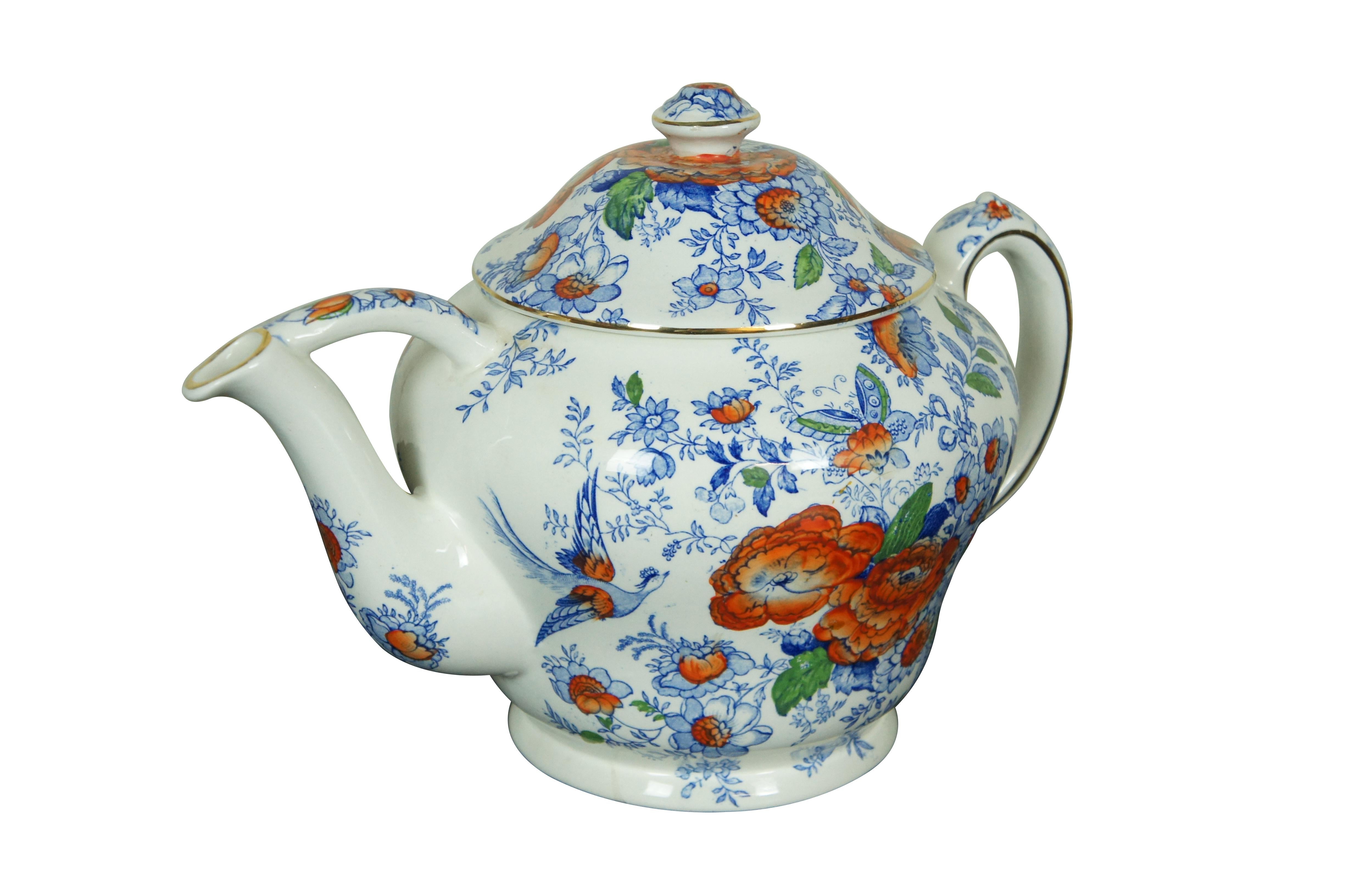 Early to mid 20th century oversized porcelain tranferware tea / coffee pot by Maling Pottery. Features a Chinoiserie design in blue and orange of flowers / chrysanthemums, birds, butterflies and gilded trim. Mark used circa 1920-1963.

