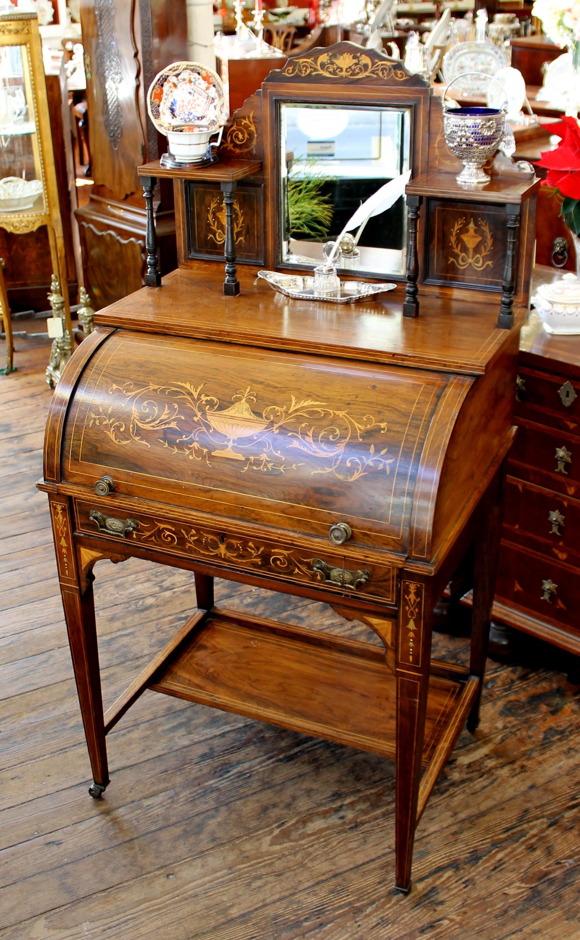Fabulous quality antique English marquetry inlaid rosewood cylinder-top ladies writing desk with marvelous fitted interior including pigeon holes and a leathered writing slope which is ratcheted to stand at an angle for writing. There is also a