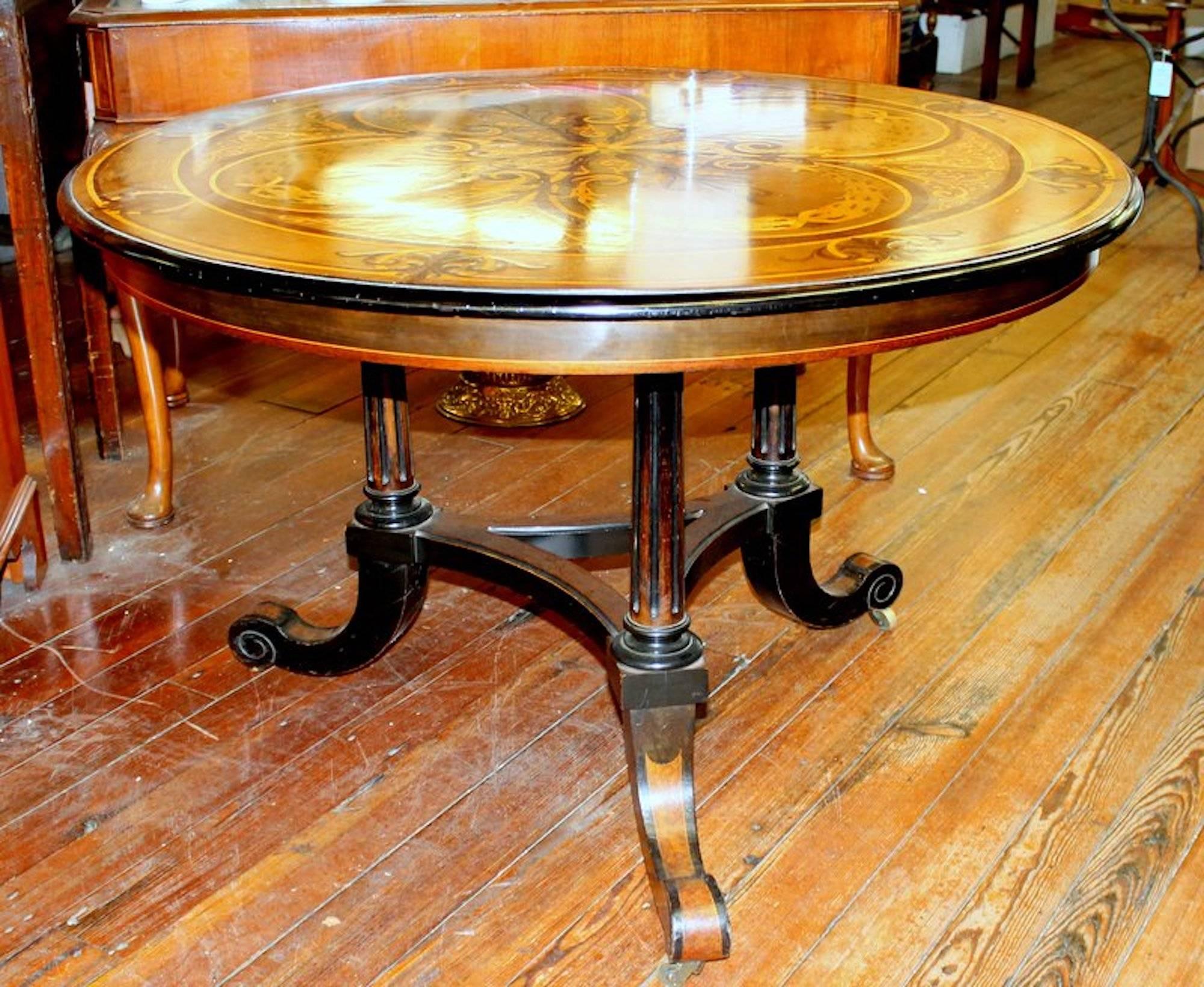 Remarkably rare and important antique English marquetry inlaid specimen or centre table, aesthetic movement.

Please note ebonized legs and base against a burr walnut veneer with six different 