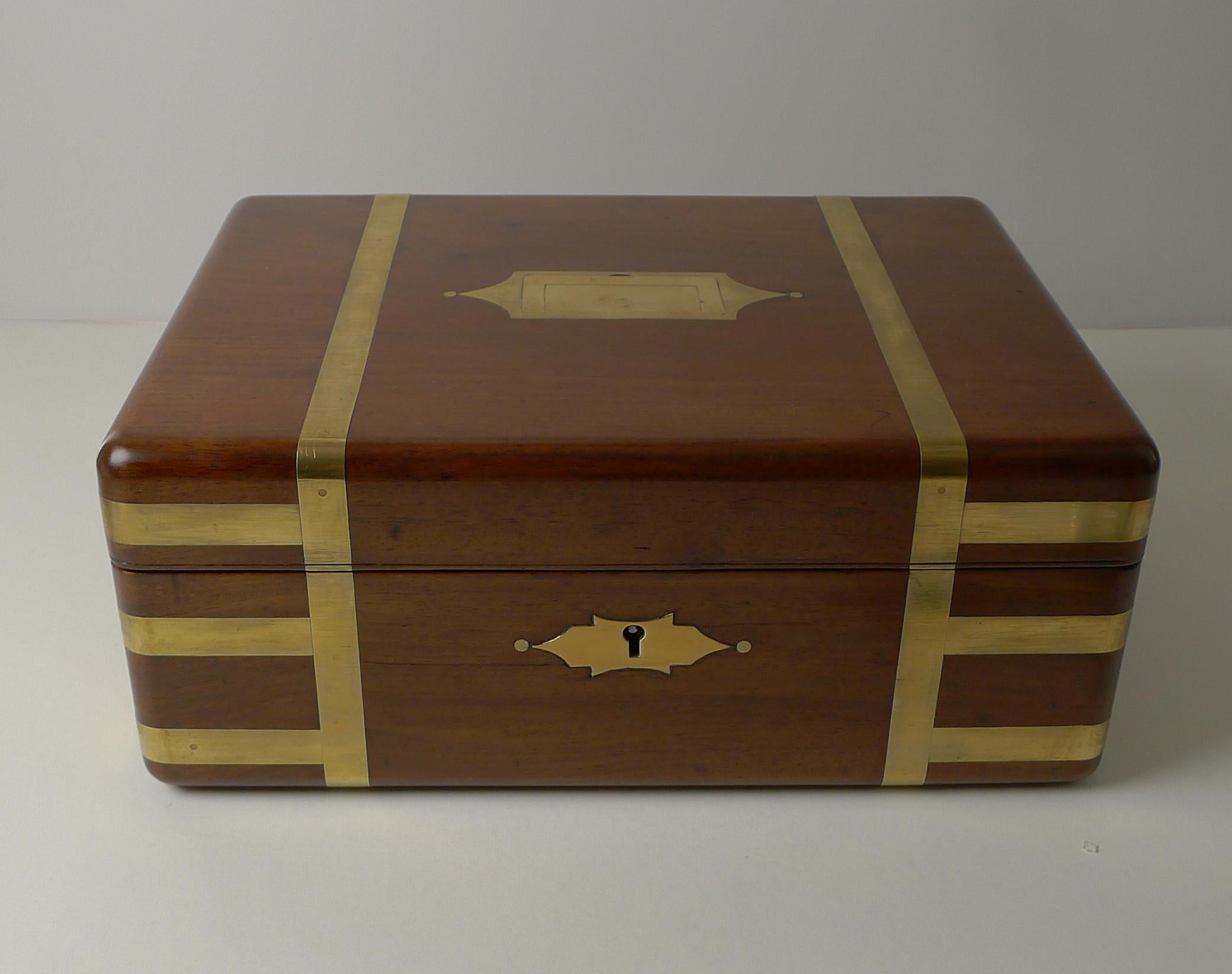 A great early nineteenth century brass bound campaign box made from a very hefty piece of solid wood. This top-notch example box is beautifully brass bound and has a flush inlaid brass military style handle to the top.

The box is beautifully