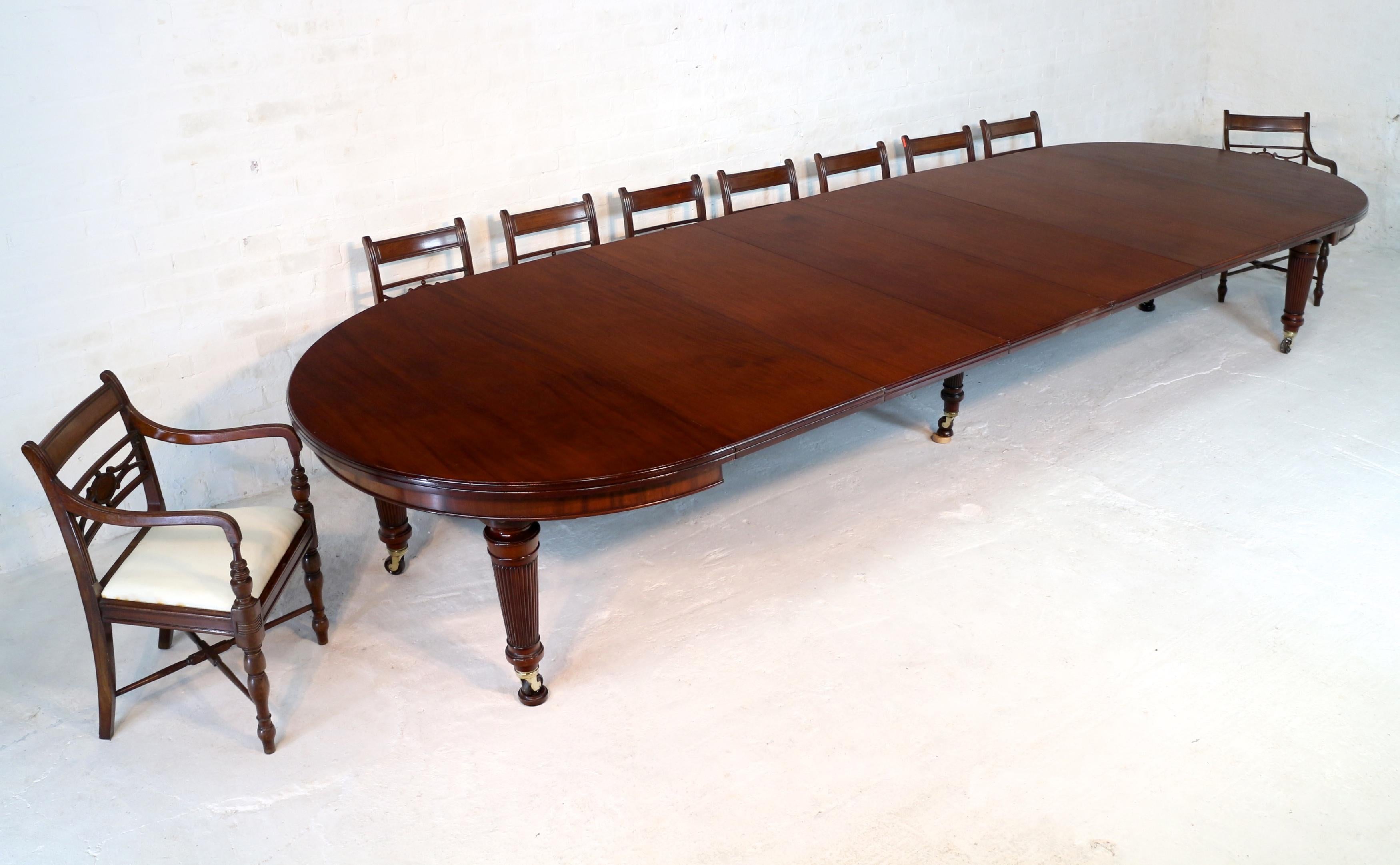 A super quality antique Victorian mahogany campaign dining table with six additional leaves and firmly attributed to Edwards & Roberts of London. This large 5ft round table smoothly extends to 15ft by means of a double Joseph Fitter ‘screw expander’