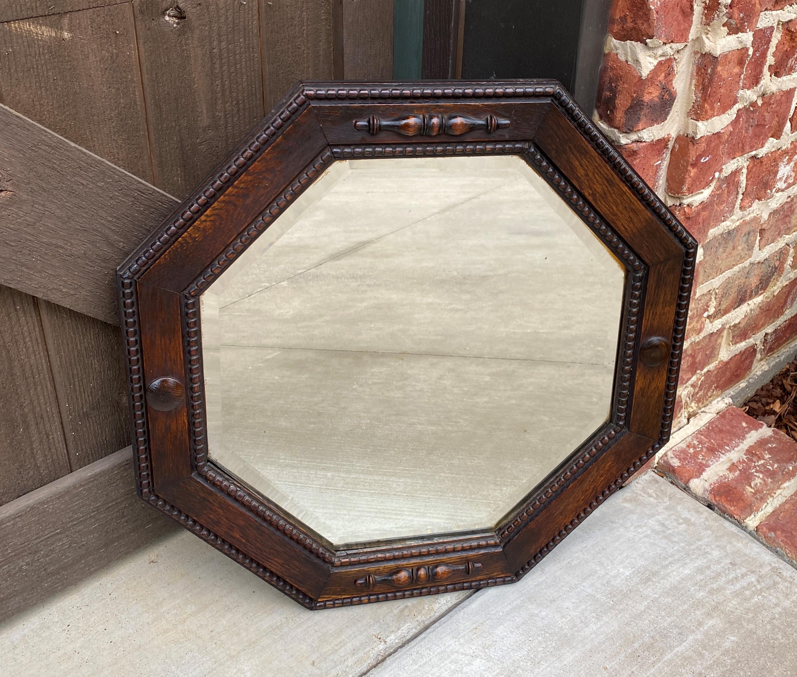 Antique English Mirror Jacobean Carved Oak Framed Beveled Mirror Octagonal 1930s In Good Condition In Tyler, TX