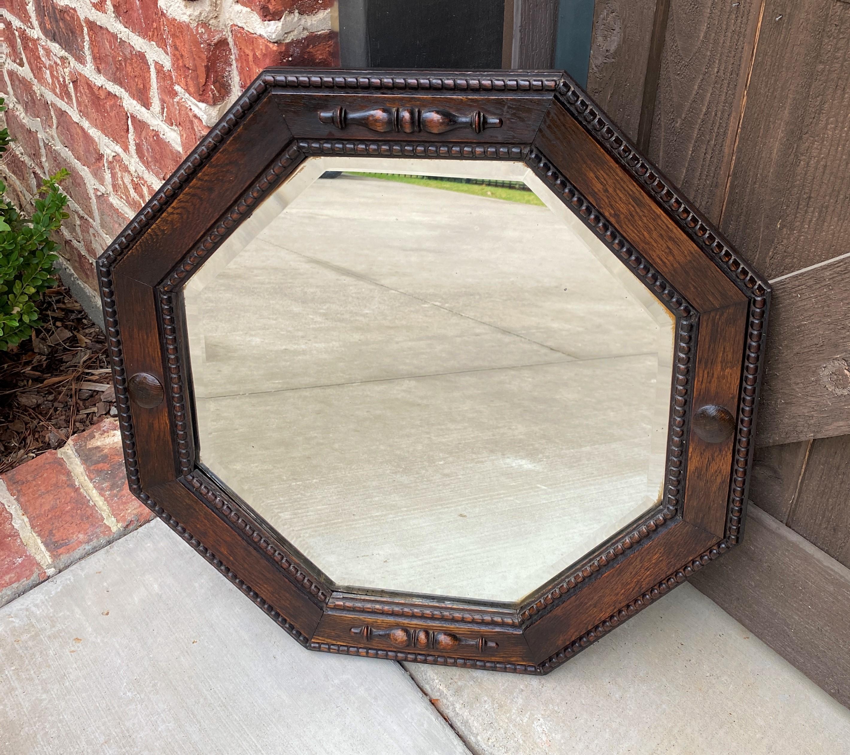 Mid-20th Century Antique English Mirror Jacobean Carved Oak Framed Beveled Mirror Octagonal 1930s