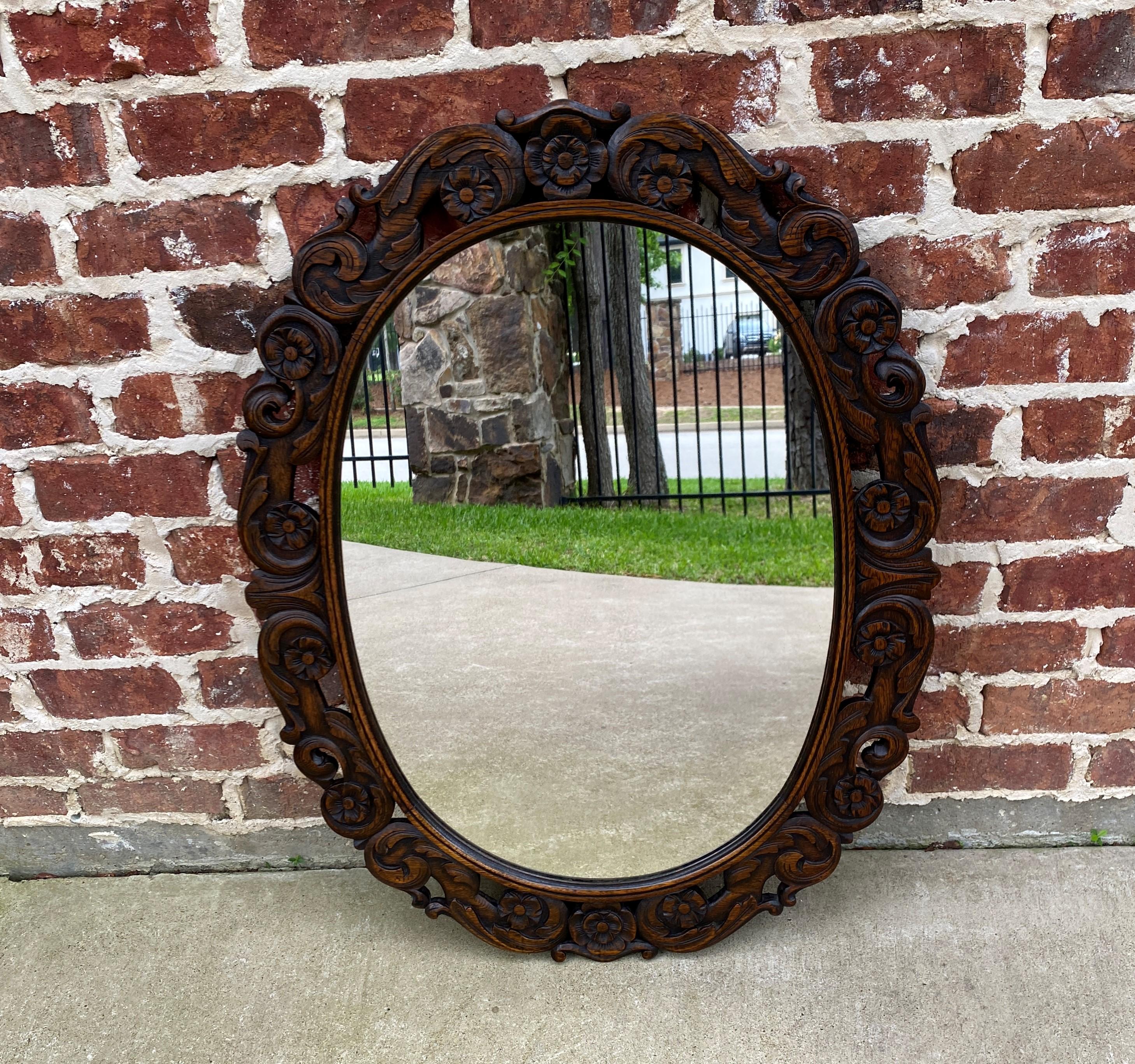 Beautifully Carved Antique English Oak Framed OVAL Wall Mirror~~c. 1920s
 
Traditional and timeless~~wood back with old chain for hanging~~perfect for an entry hall, powder room or any room in today's home

Versatile size

Frame is 36
