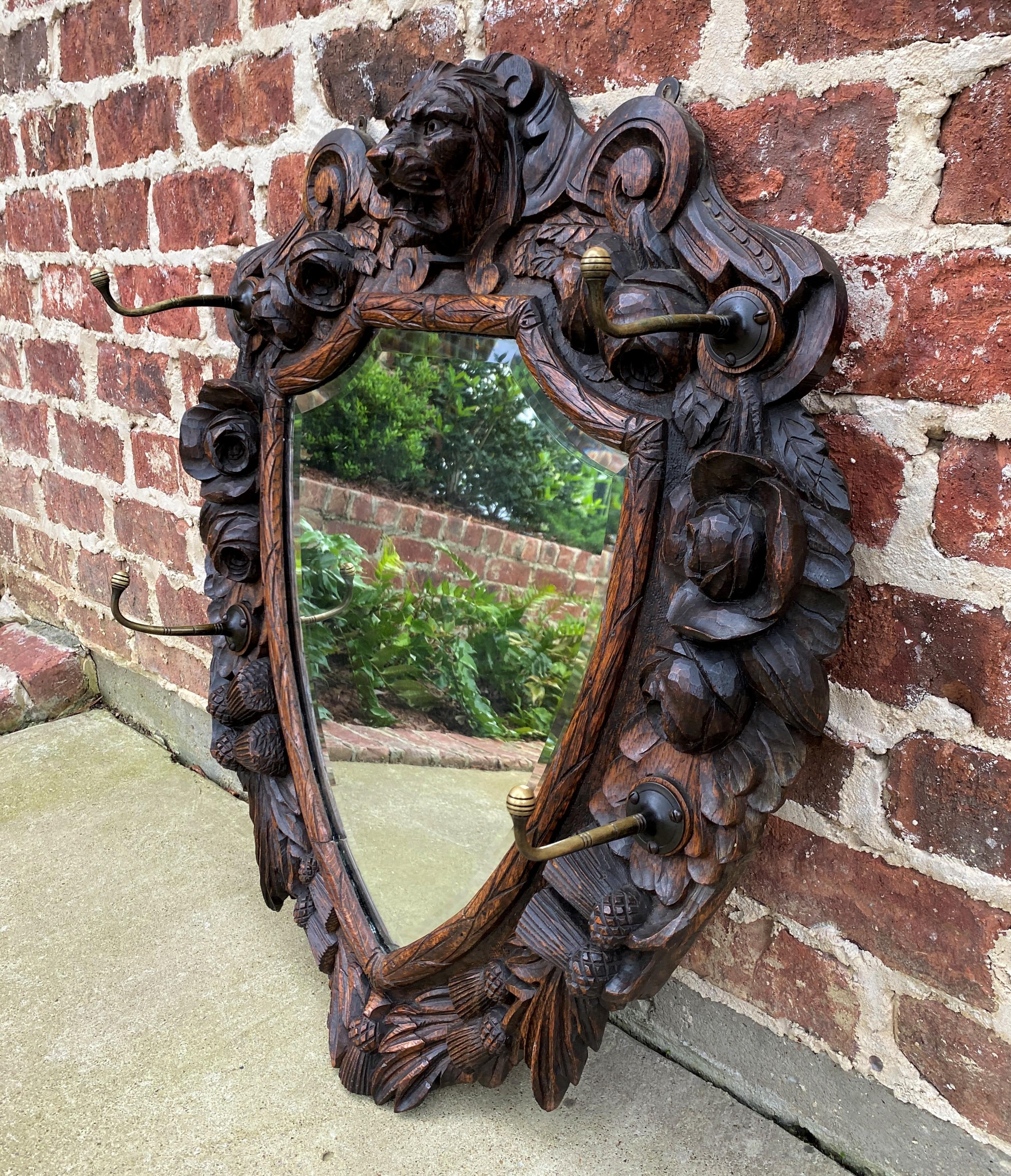 Carved Antique English Mirror Renaissance Revival Oak Frame Shield Shape Lion Wood Back